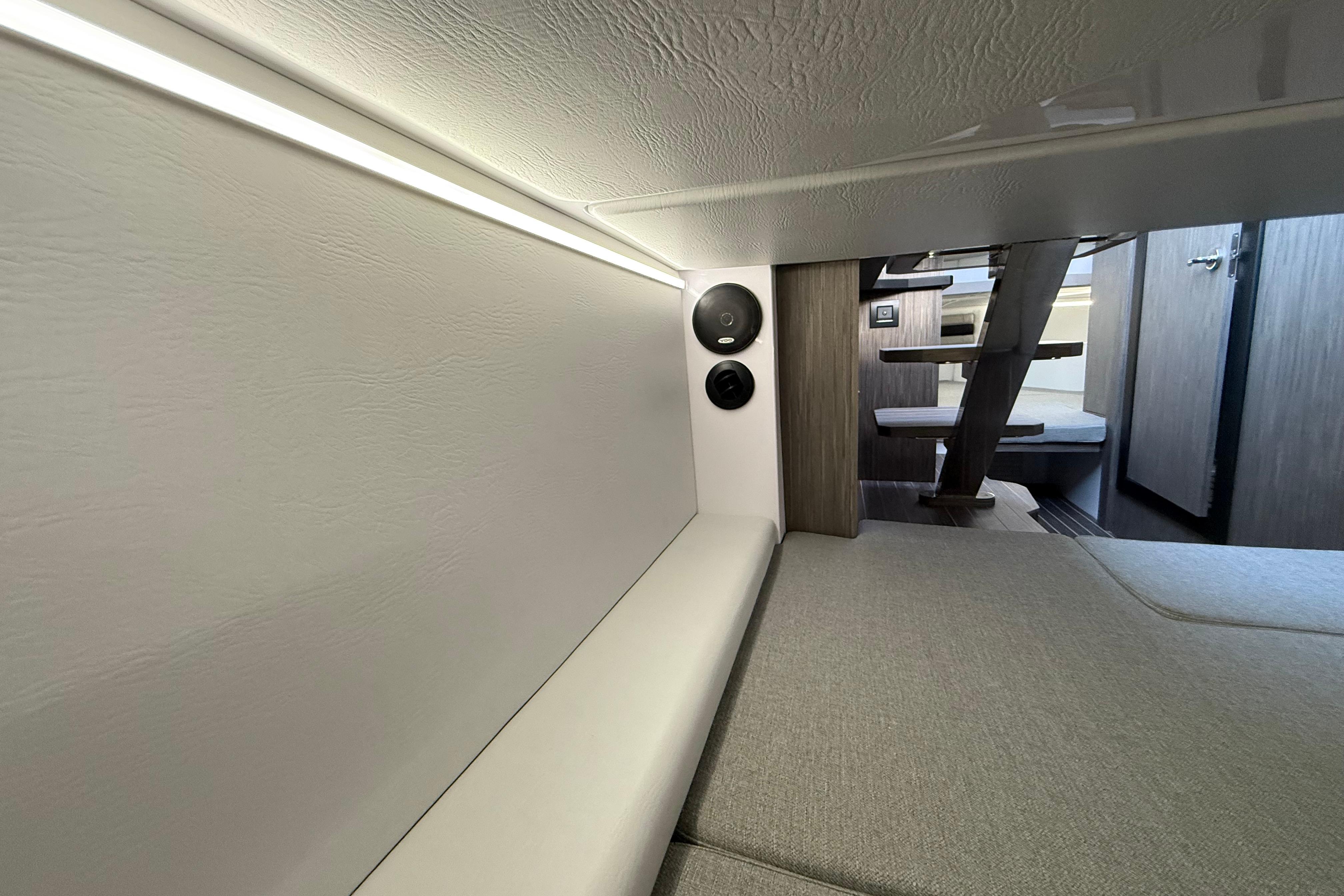Interior of 2026 Ranieri CAYMAN 38.0 EXECUTIVE yacht, featuring modern seating and lighting.