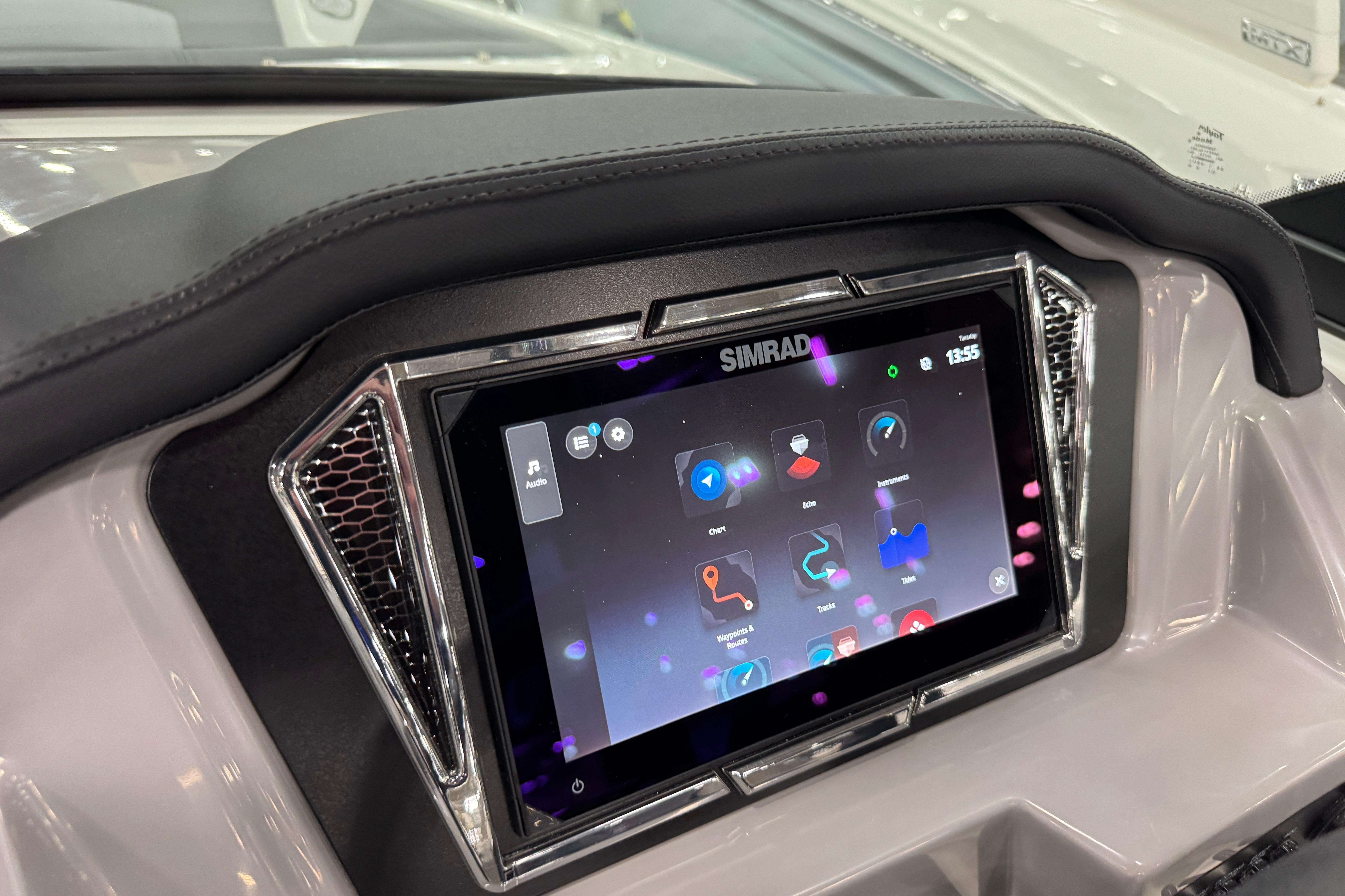 2026 Chaparral 23 SSi boat dashboard with Simrad touchscreen display.