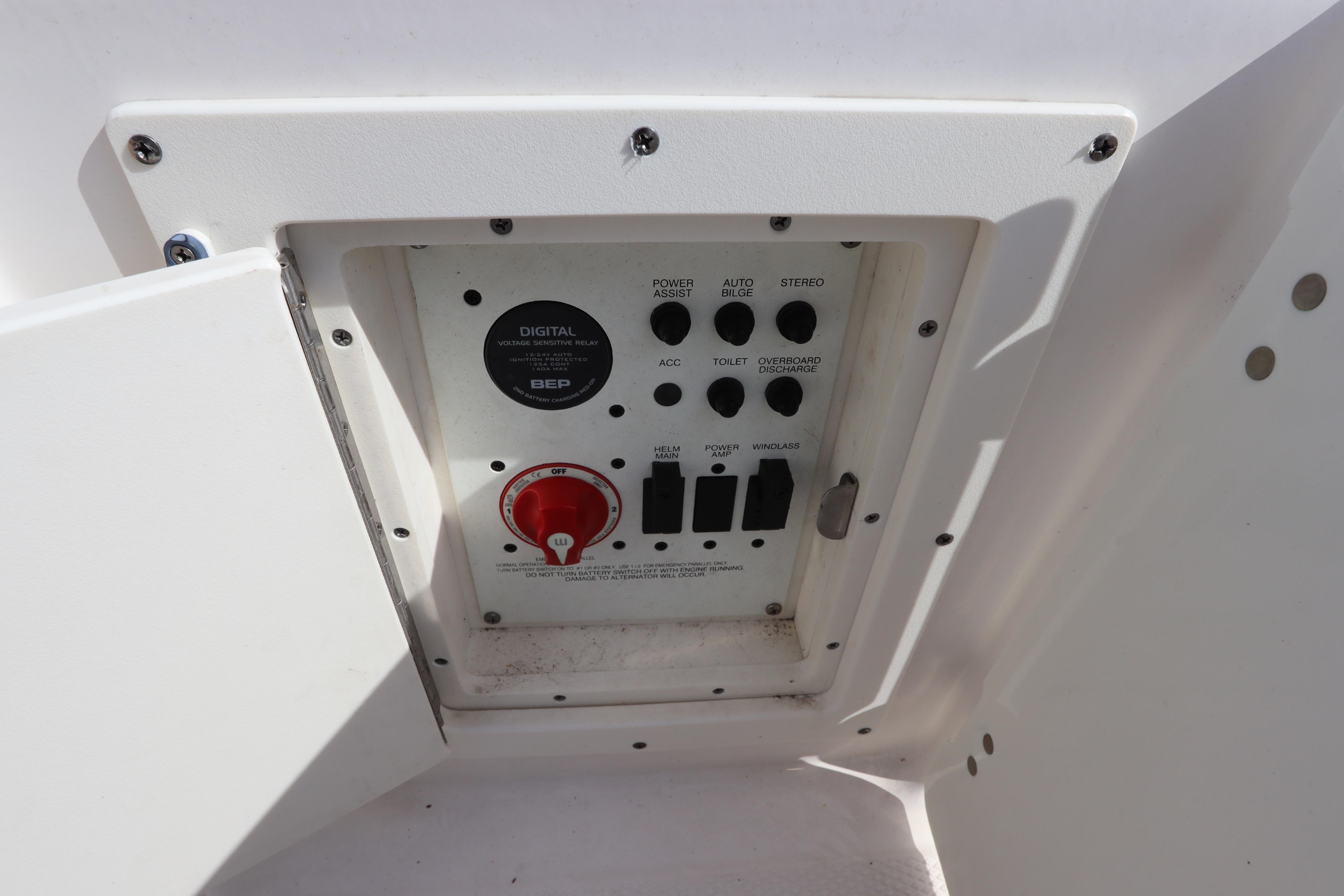 Control panel of a 2019 Robalo R242 Center Console boat, featuring various switches.
