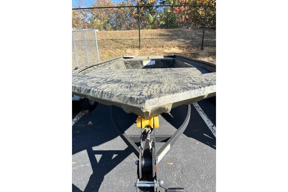 2026 Tracker Grizzly 1754 Utility boat on trailer, parked outdoors.