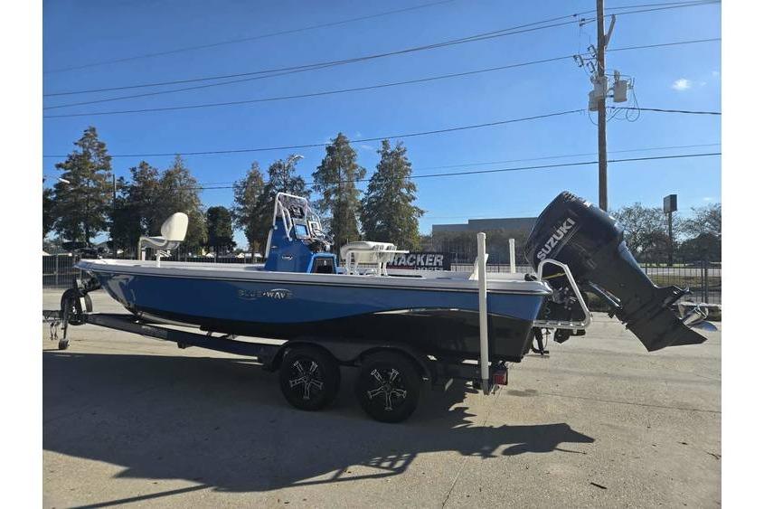 2020 Blue Wave 2400 PureBay boat with Suzuki outboard motor on trailer.