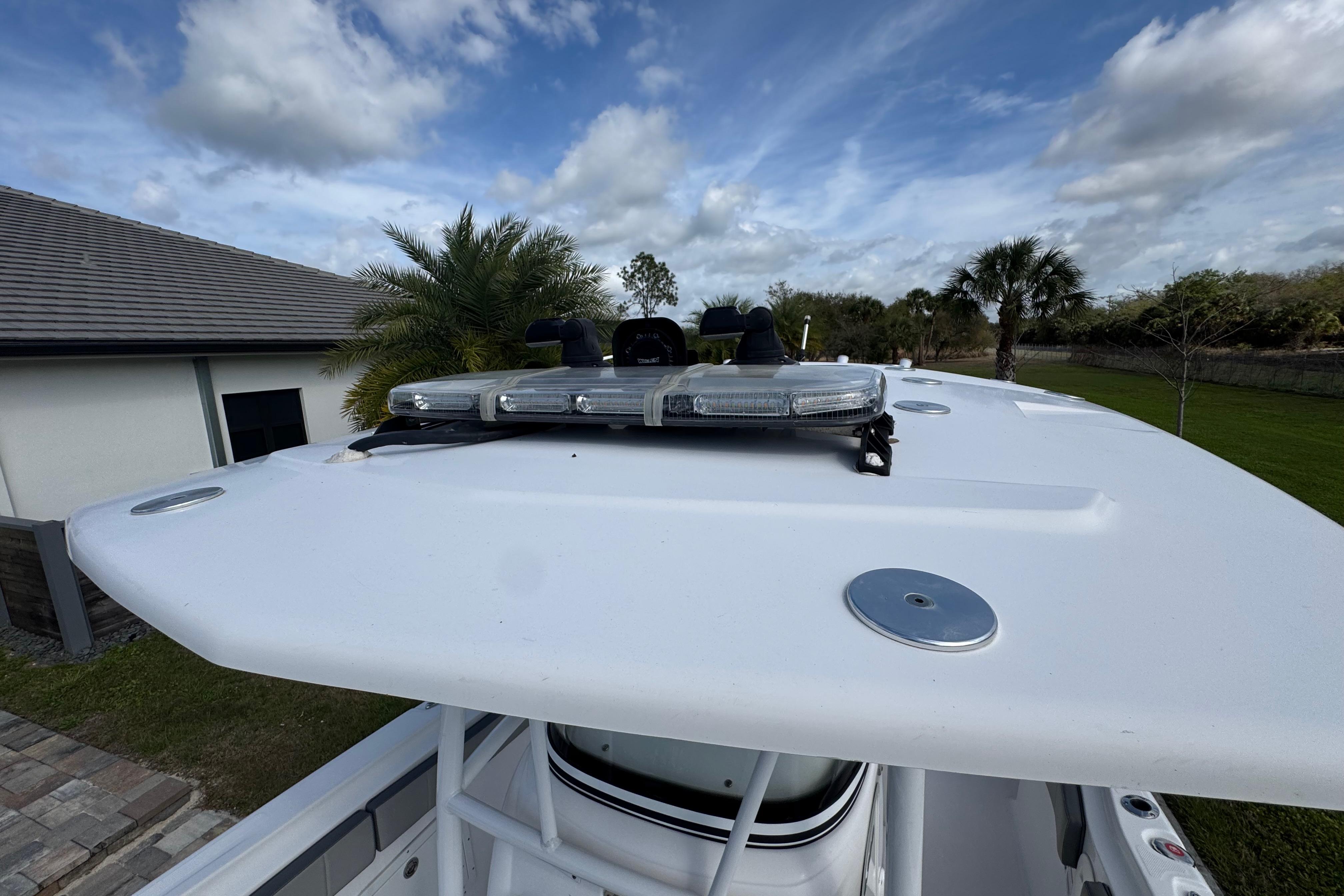 2022 Aquasport 2500 Center Console boat with rooftop view, featuring mounted lights.