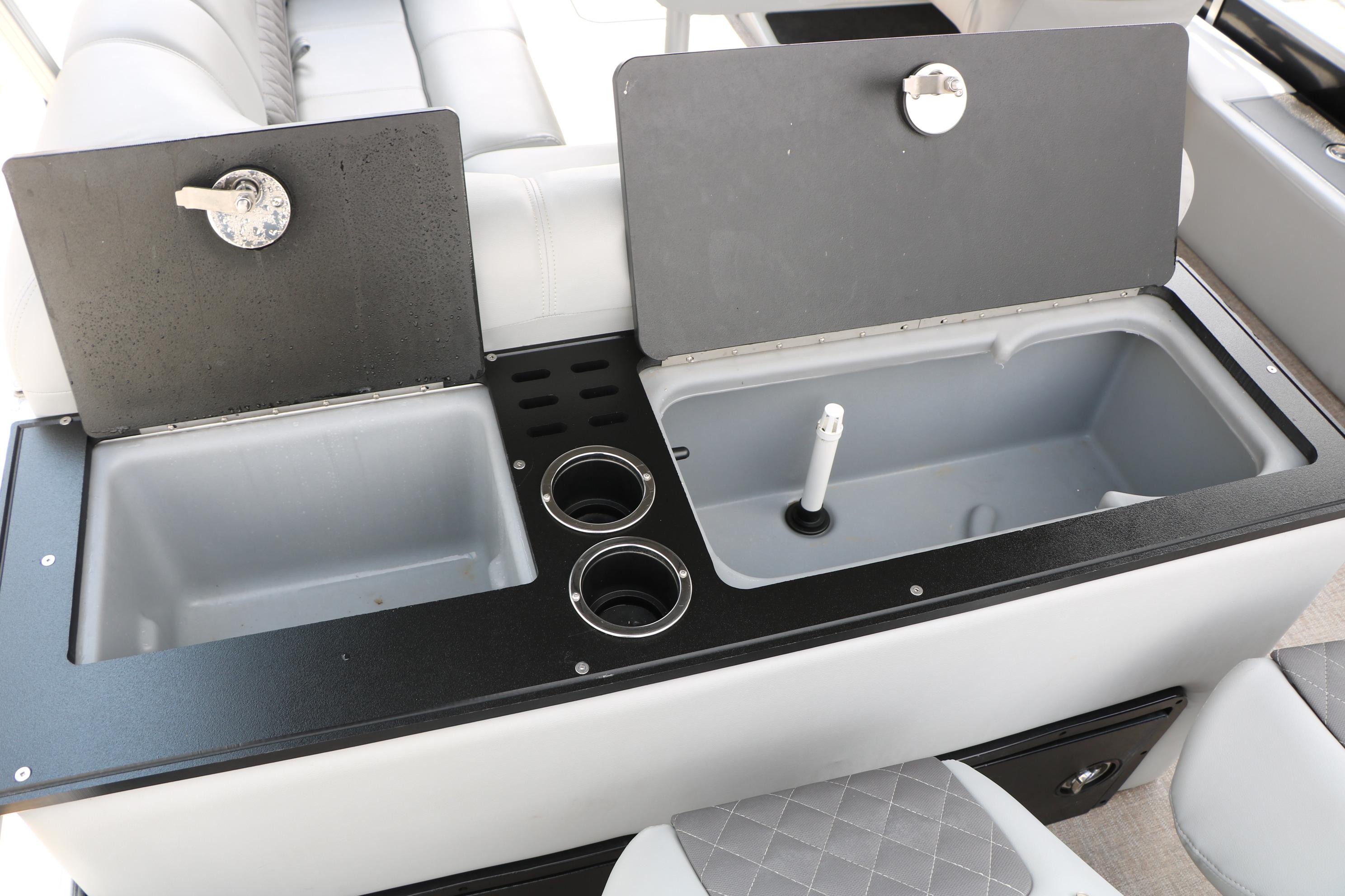 2021 Ranger 223FC boat interior with dual sinks and cup holders.
