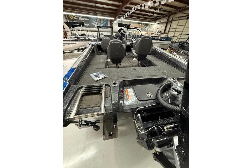 2024 Nitro ZV21 boat interior with seating and equipment in showroom.