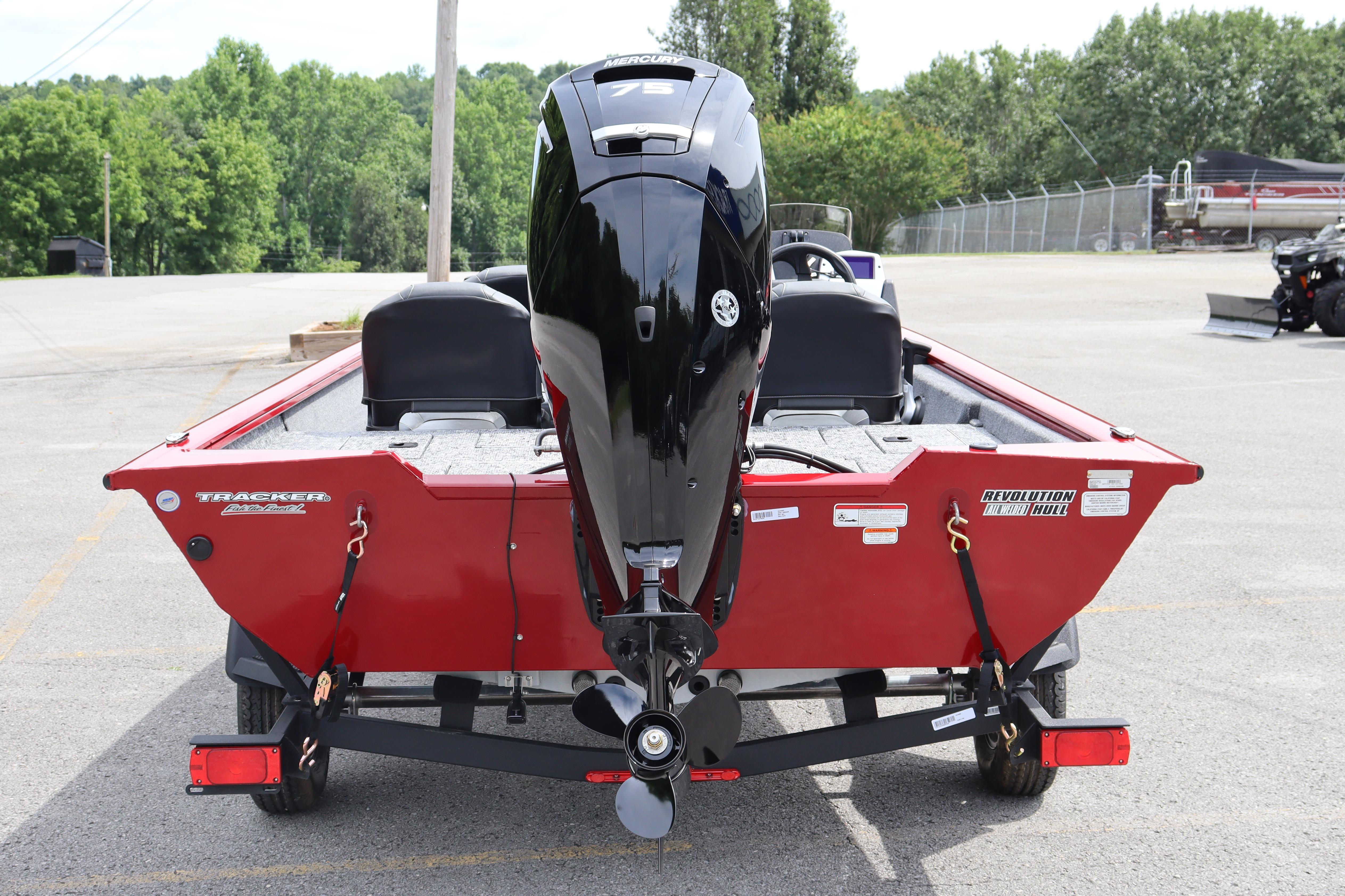 2026 Tracker Pro Team 175 Crappie Edition boat, red, rear view in parking lot.
