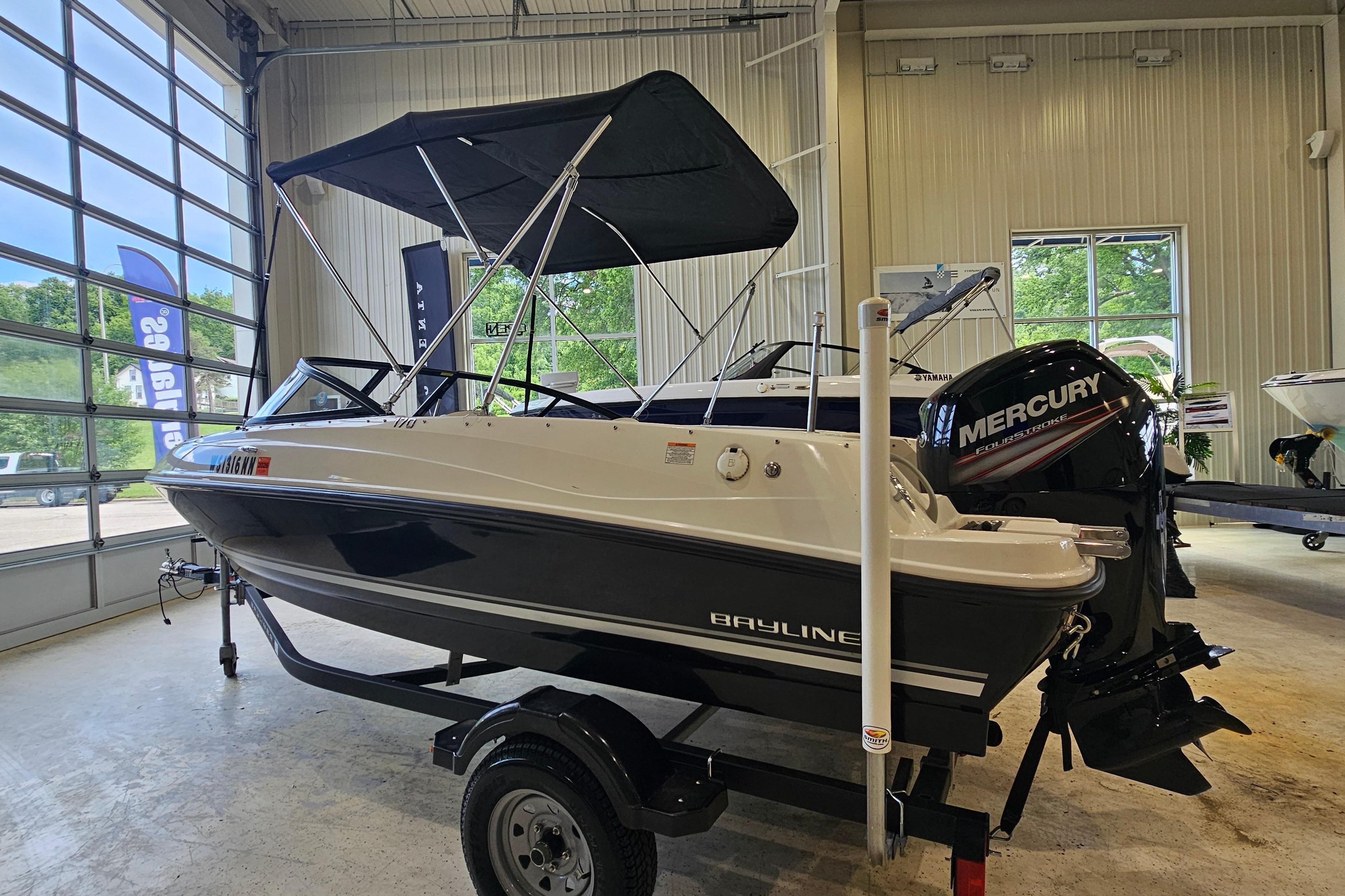 2019 Bayliner 170 Bowrider with Mercury engine in showroom setting.