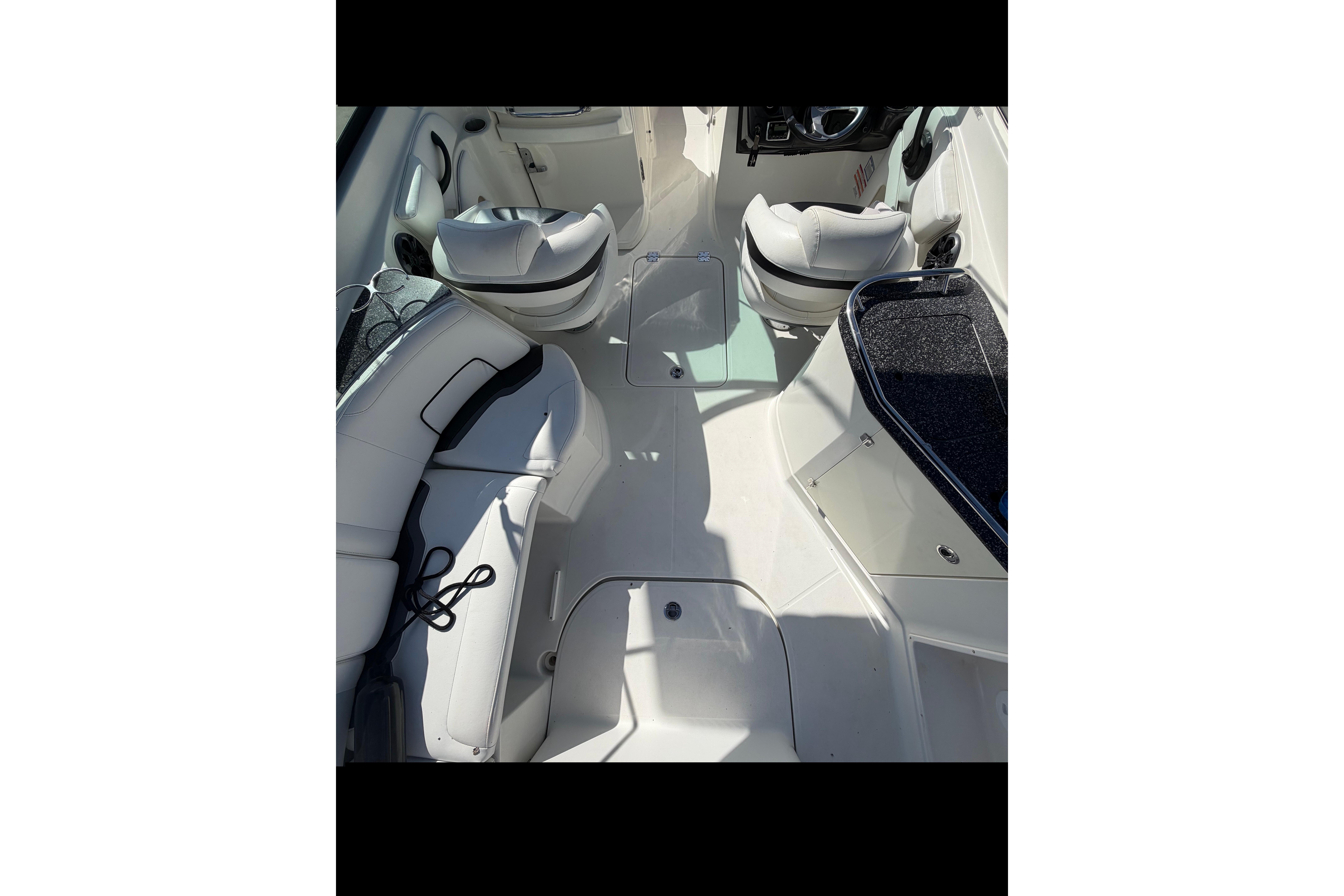 2015 Monterey 264FS boat interior with white seating and sleek design.