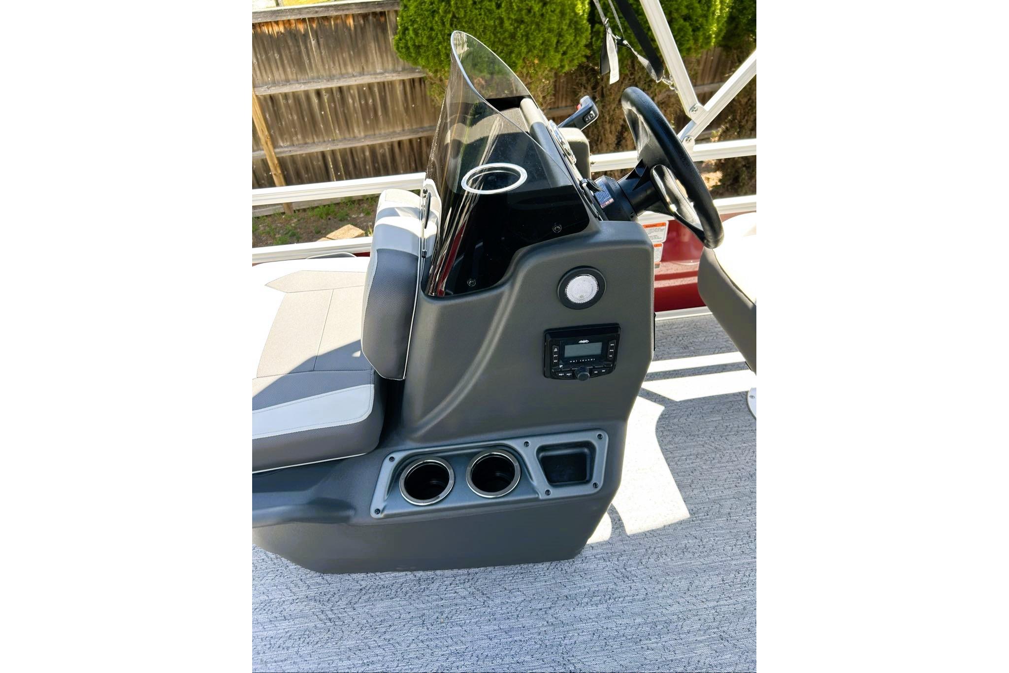 2026 Sun Tracker Bass Buggy 16 XL Select boat console with steering wheel and controls.