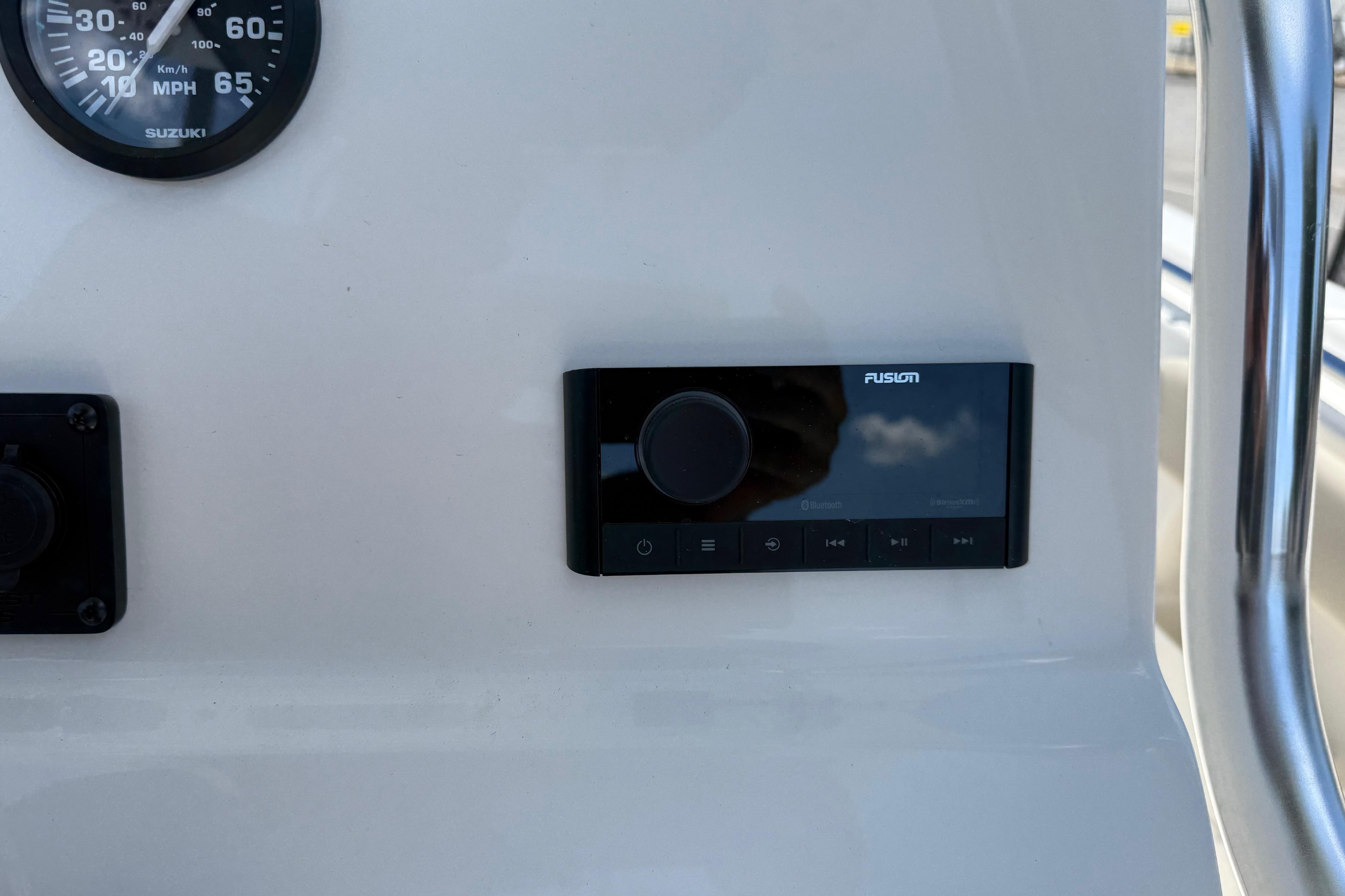 Control panel of 2026 Key West 239 FS boat with speedometer and audio system.