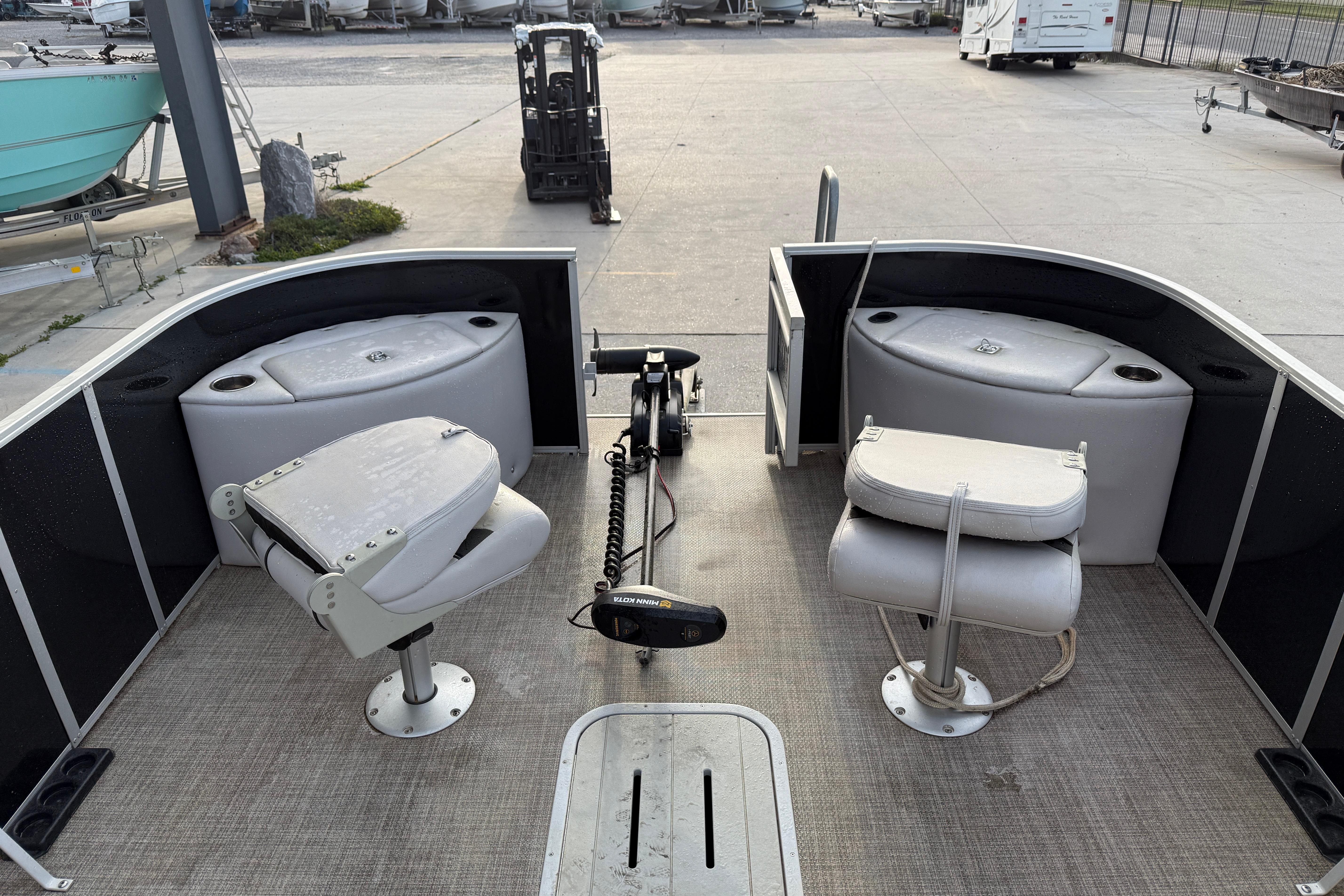 2022 Custom G3 Suncatcher 322FC pontoon boat interior with seating and fishing equipment.