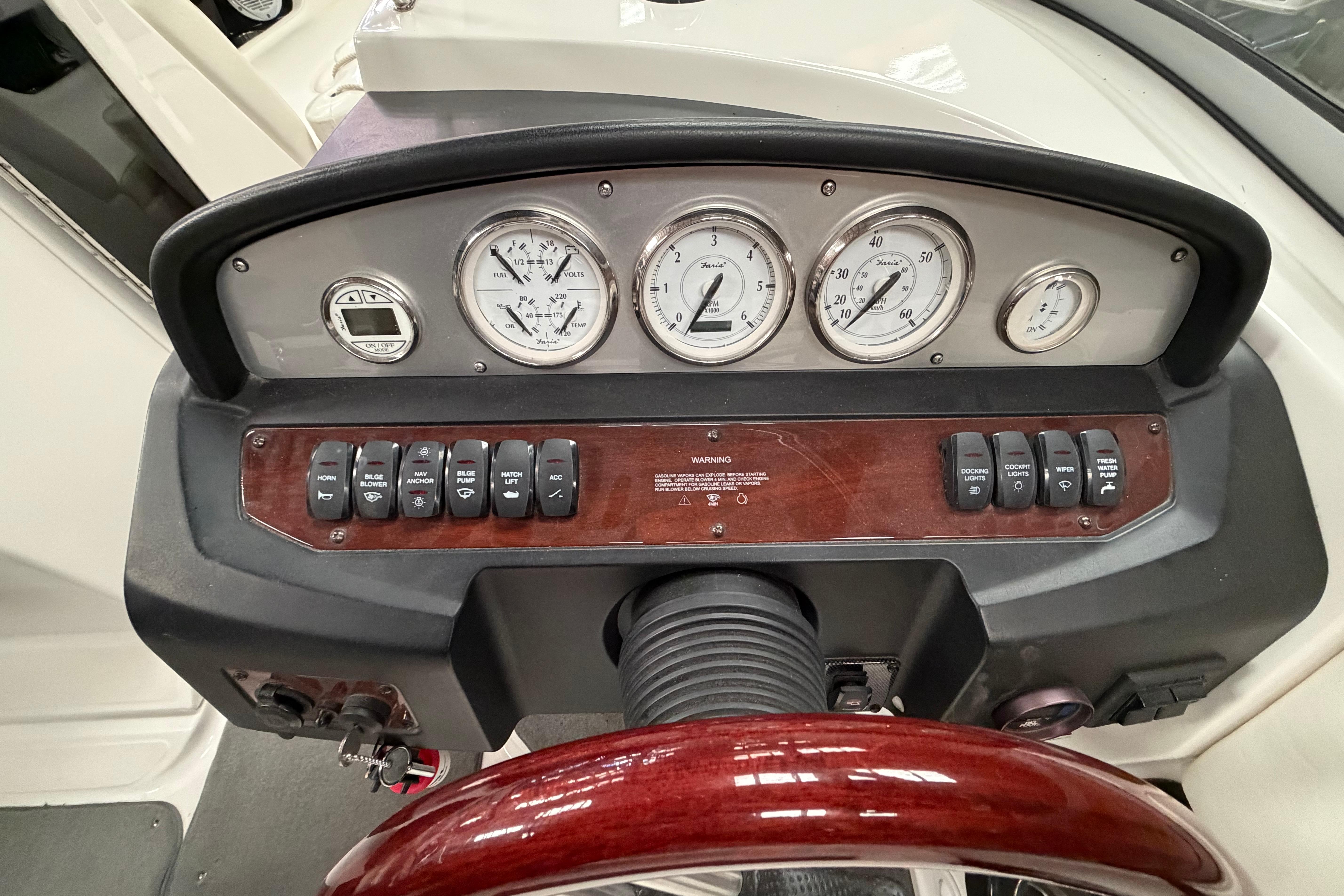 Dashboard of a 2008 Regal 2700 Bowrider boat with gauges and controls.