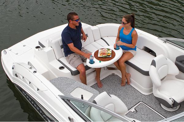 Manufacturer Provided Image: 2016 Chaparral 244 Sunesta boat with two people dining onboard.