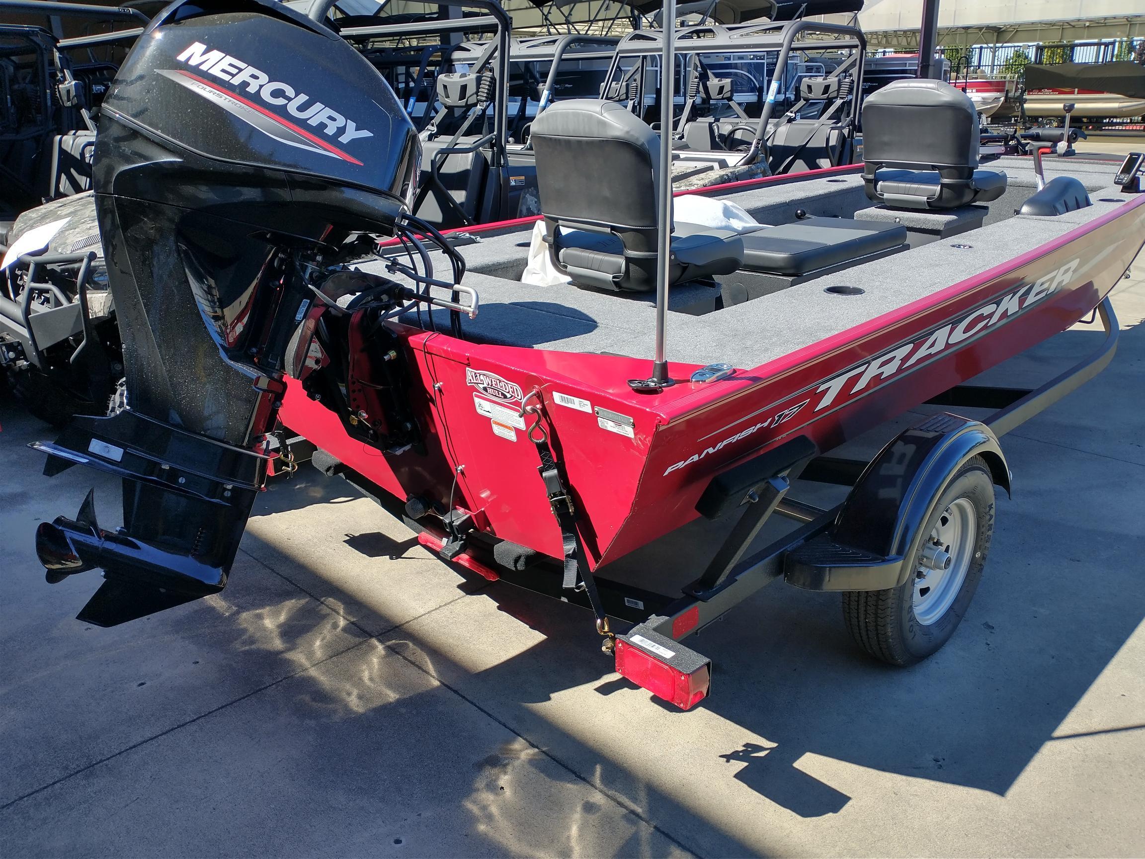 2025 Tracker Panfish 17 boat with Mercury engine, red exterior, parked on trailer.