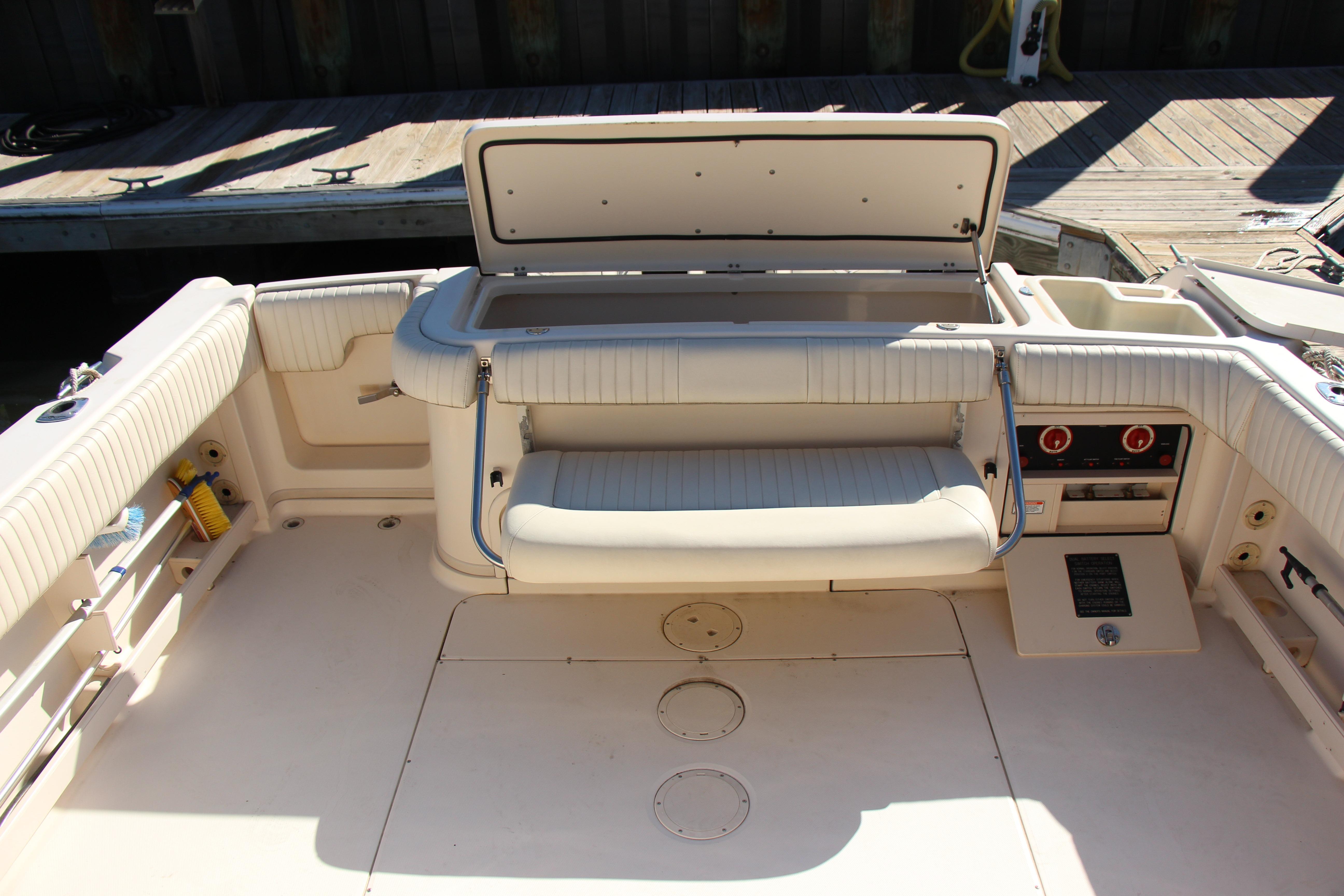 2005 Grady-White Express 330 boat interior with open storage compartment and seating.