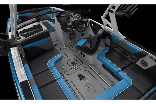 Manufacturer Provided Image: 2019 Axis A22 boat interior with blue and black seating, modern dashboard, and spacious layout.