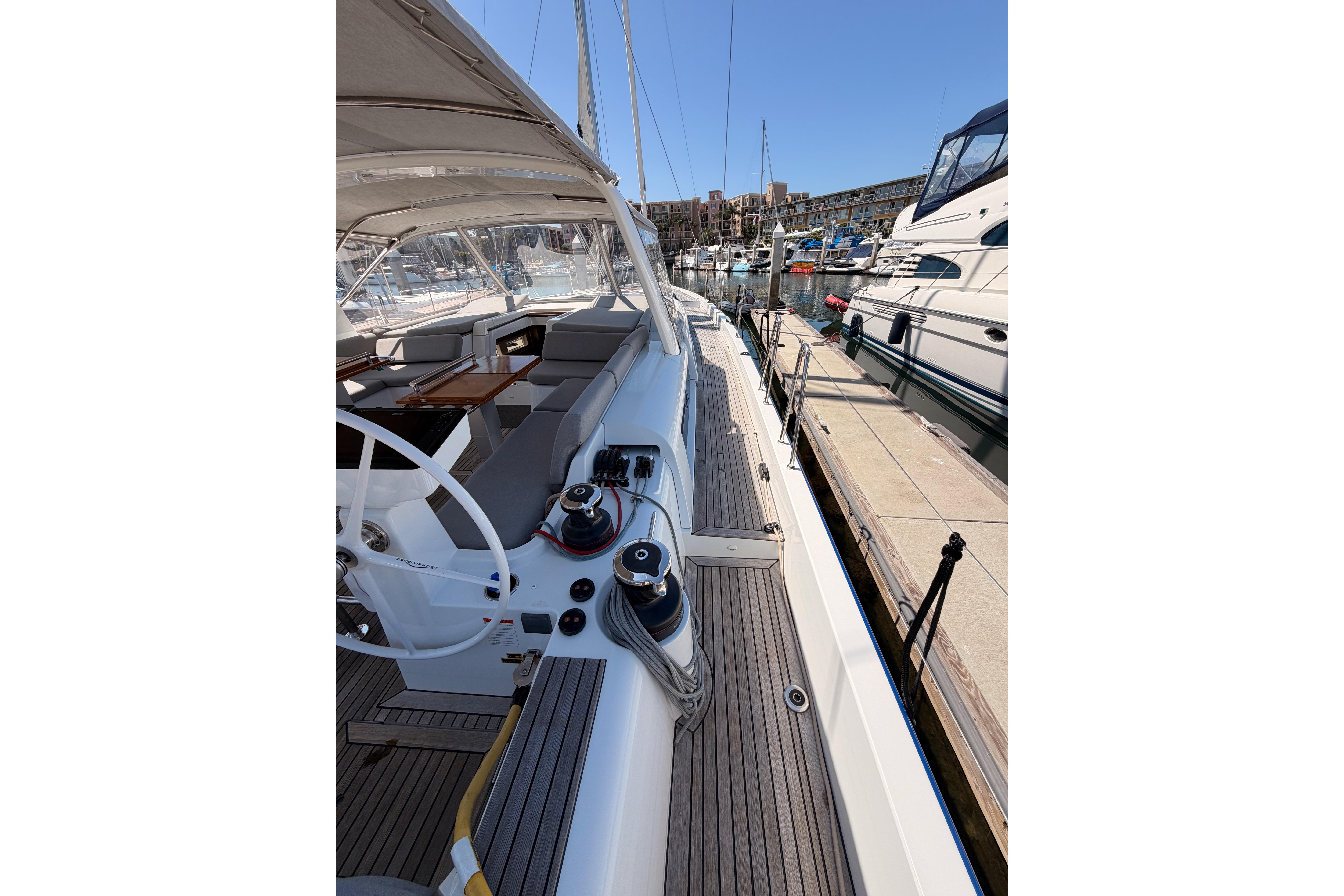2022 Beneteau Oceanis Yacht 54 docked, showcasing sleek deck and modern design.