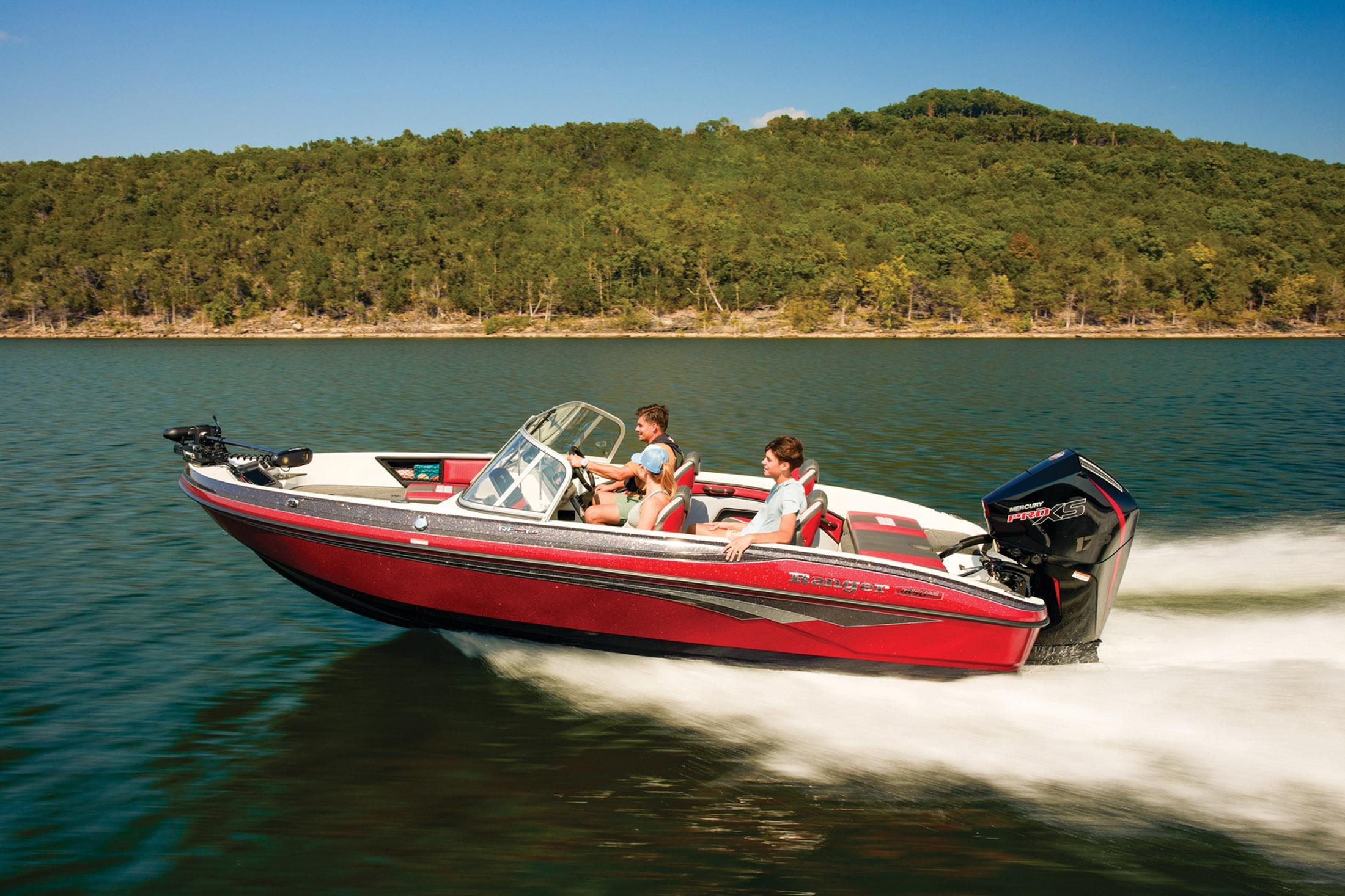 2026 Ranger 1850MS boat cruising on a lake with forested shoreline.