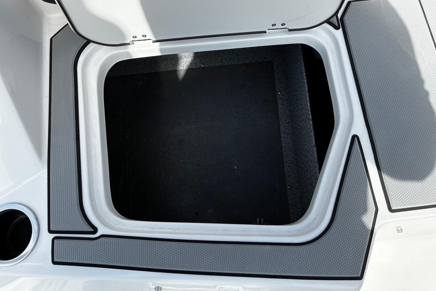 Open storage compartment on 2026 Starcraft SV 16 OB boat deck.