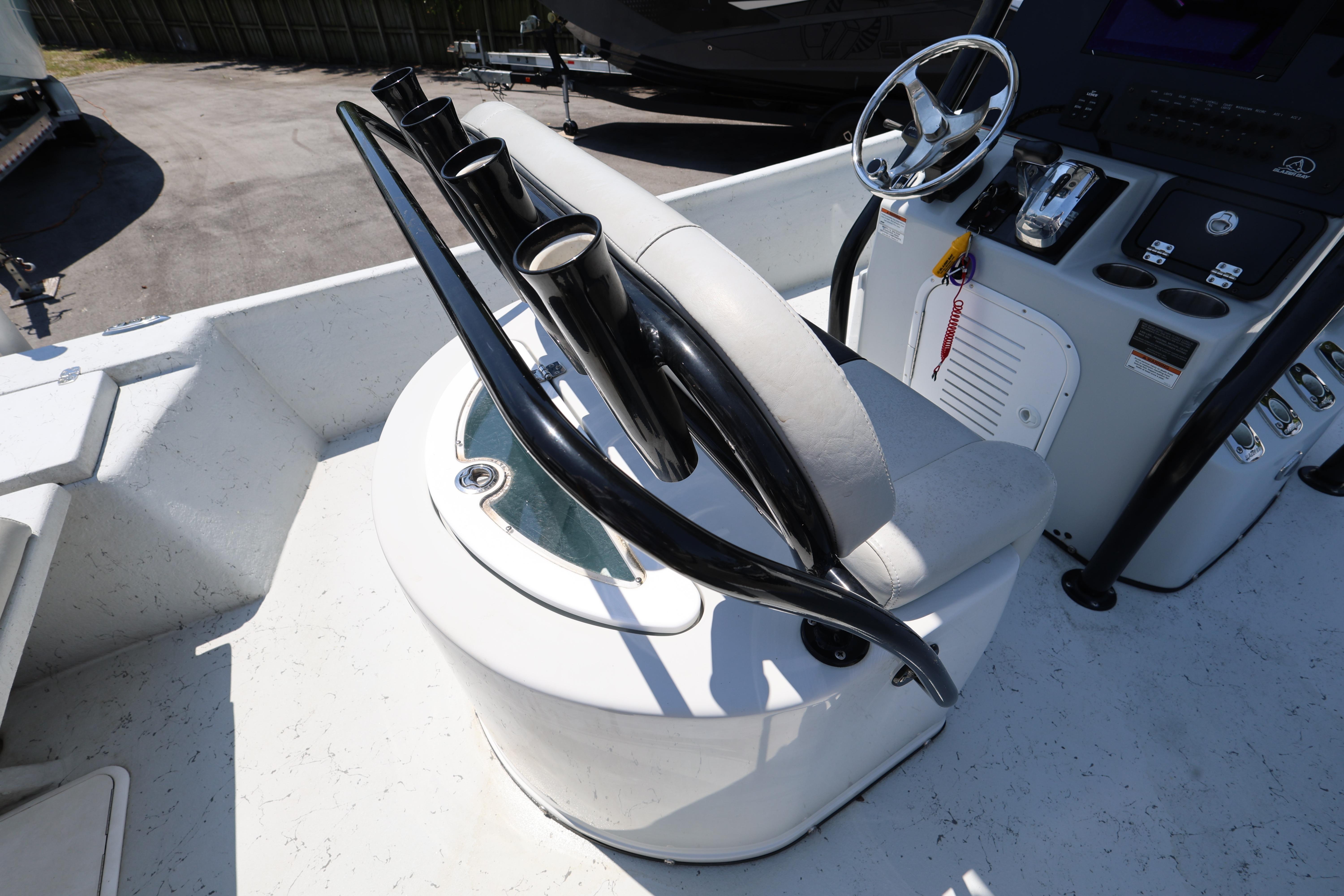 2021 Blazer Bay 2400 boat console with steering wheel and rod holders.