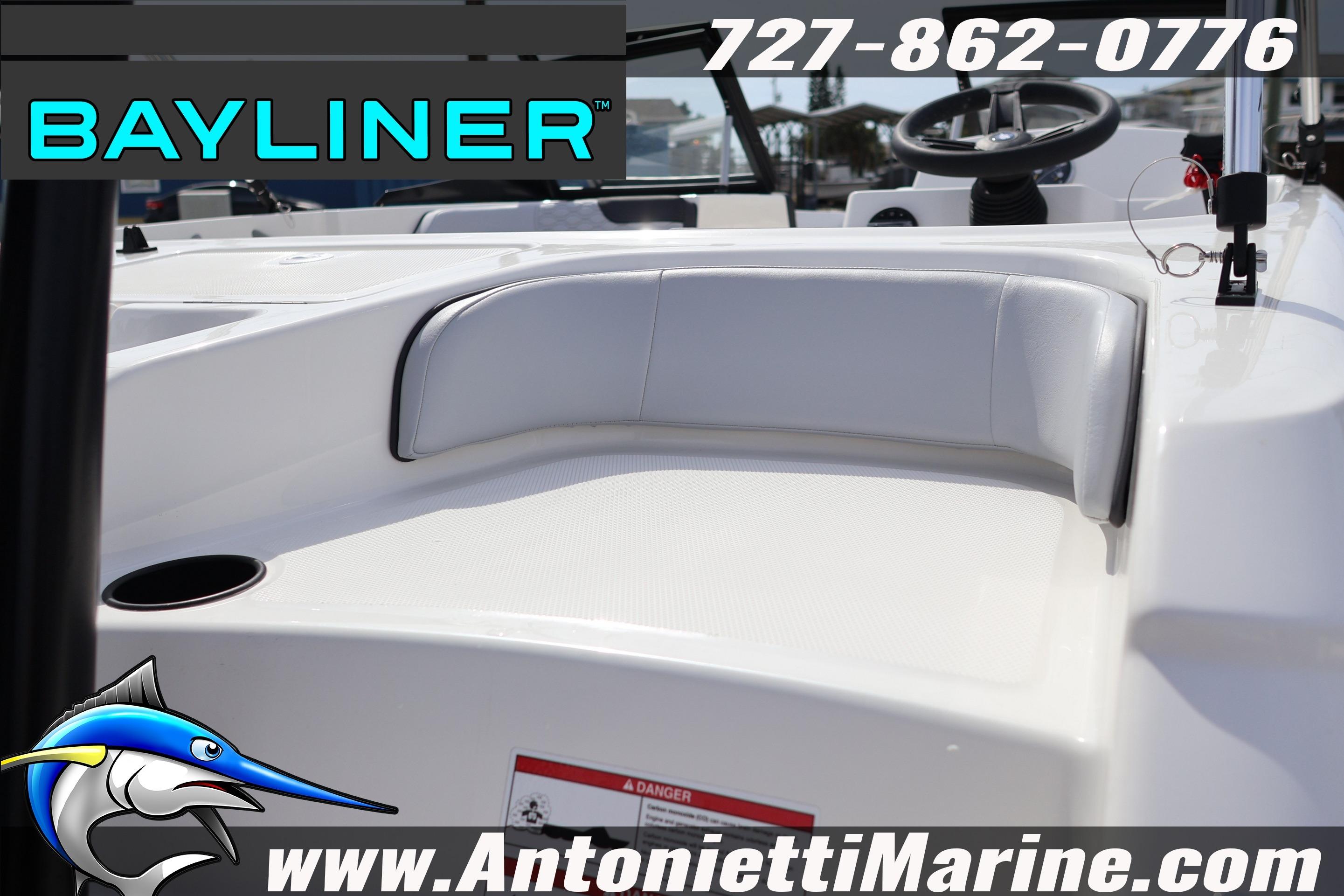 2026 Bayliner Element M17 boat interior with seating, steering wheel, and branding details.