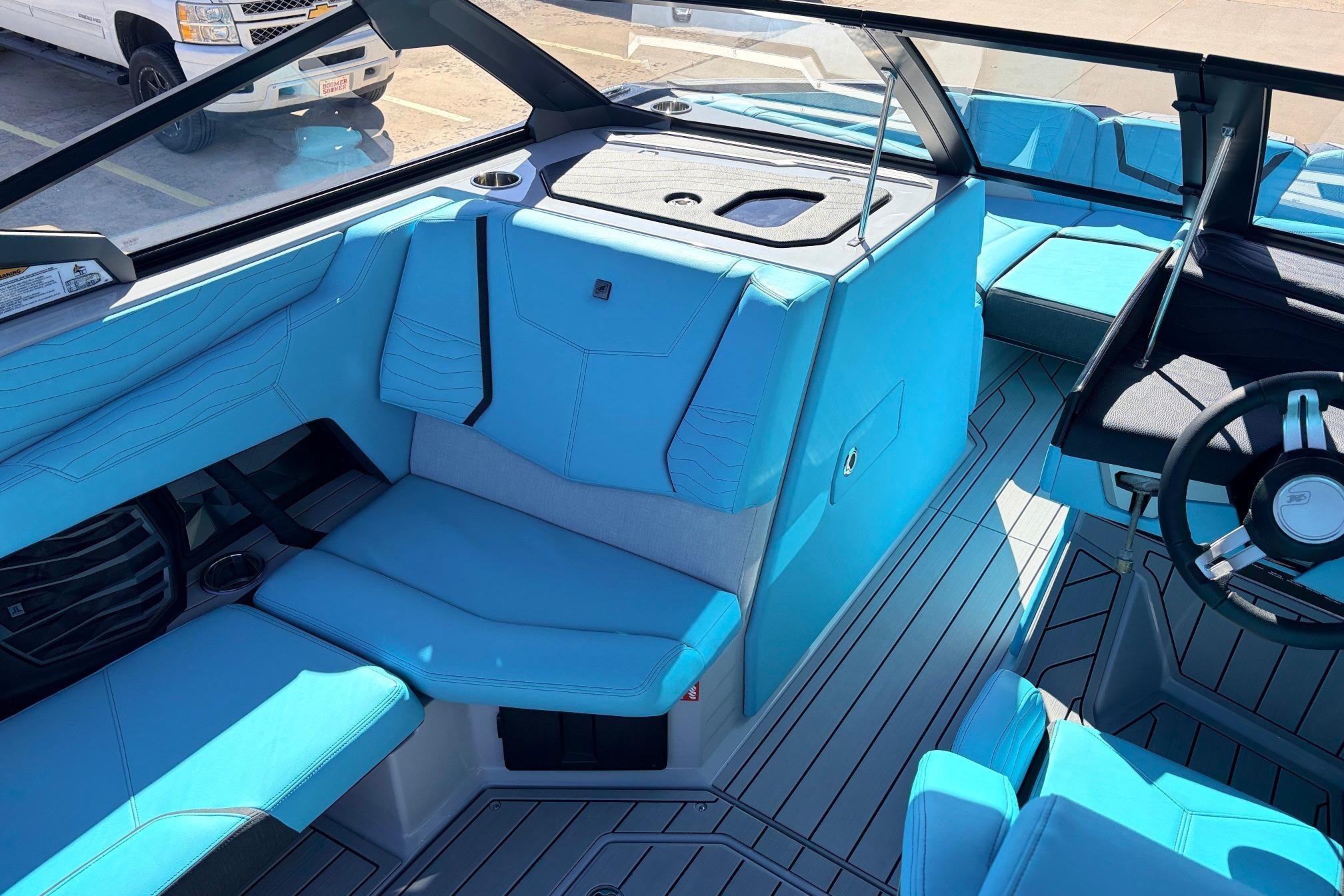 2026 Nautique Super Air Nautique G23 interior with blue seating and modern design.