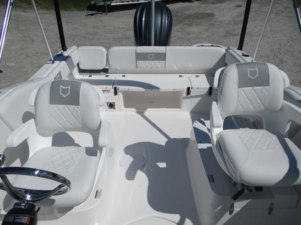 2025 Sea Fox 228 Traveler boat interior with white seating and steering wheel.