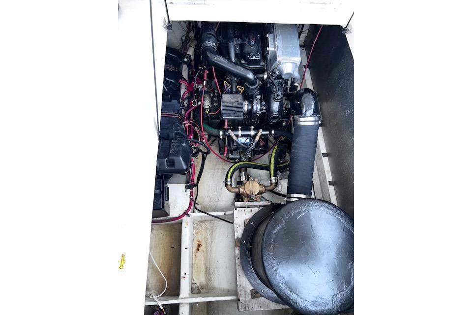 Engine compartment of 1996 Bayliner 3388 Command Bridge Motoryacht, showcasing mechanical components.