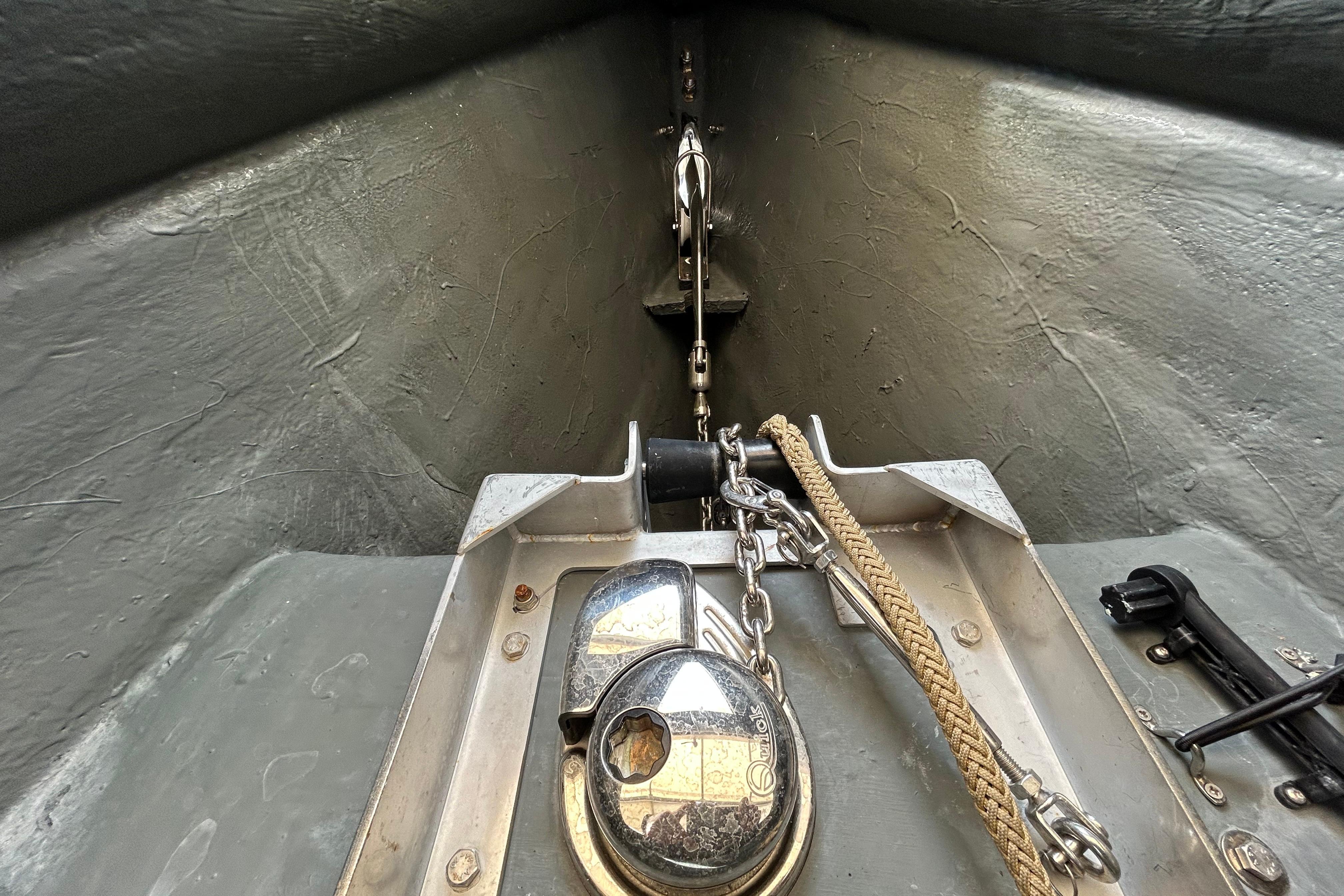 Anchor compartment of 2022 Technohull 38 Grand Sport, featuring chain and rope setup.
