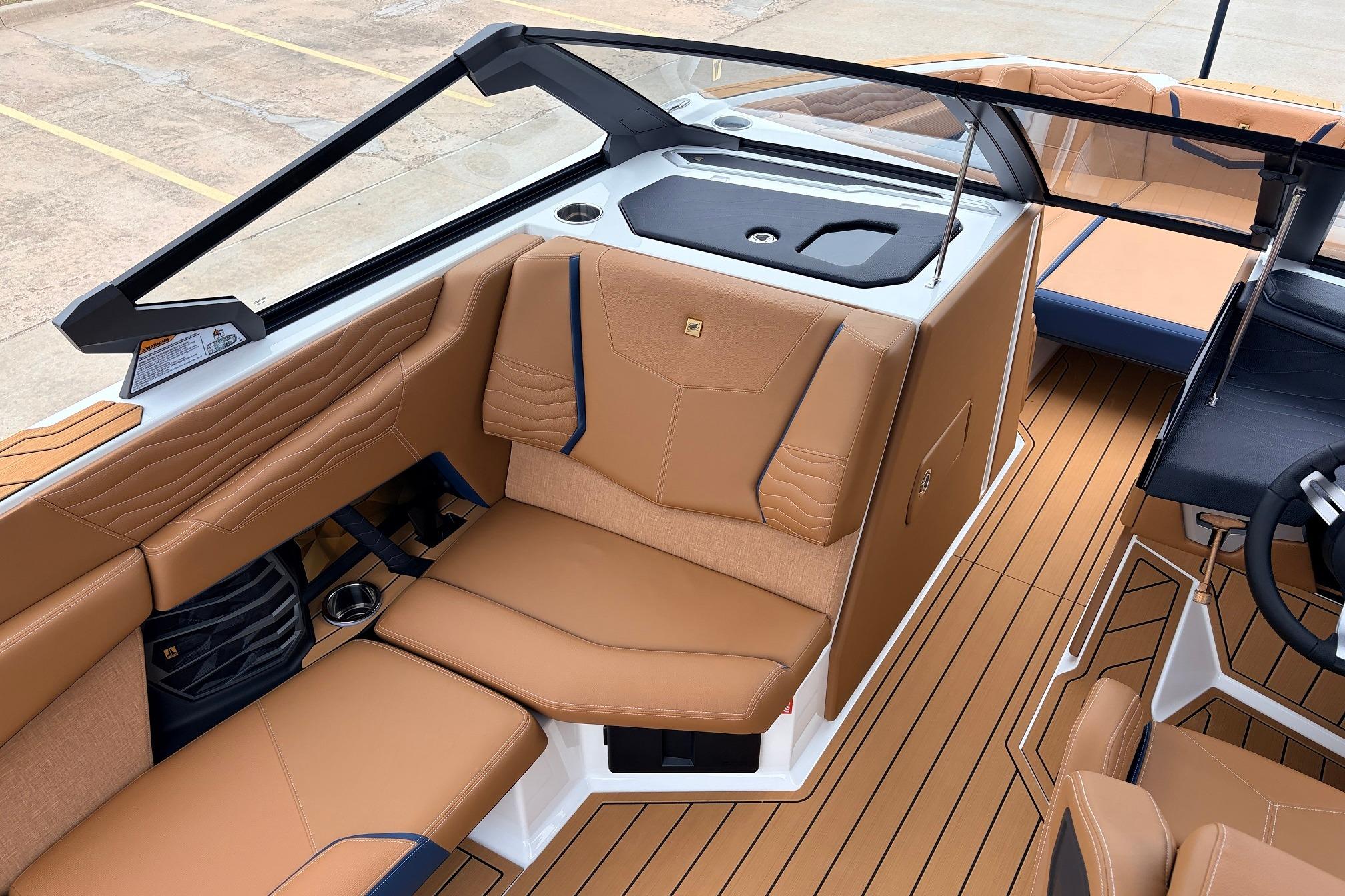 2026 Nautique Super Air Nautique G25 interior with tan leather seating and sleek design.