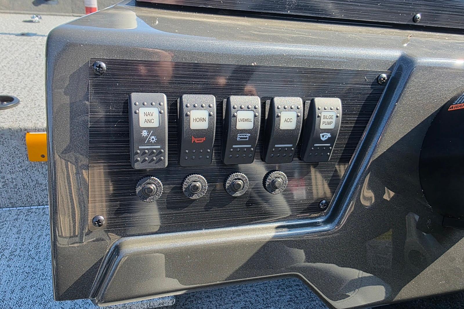 Control panel of 2026 Smoker Craft Viper 165 boat with labeled switches.