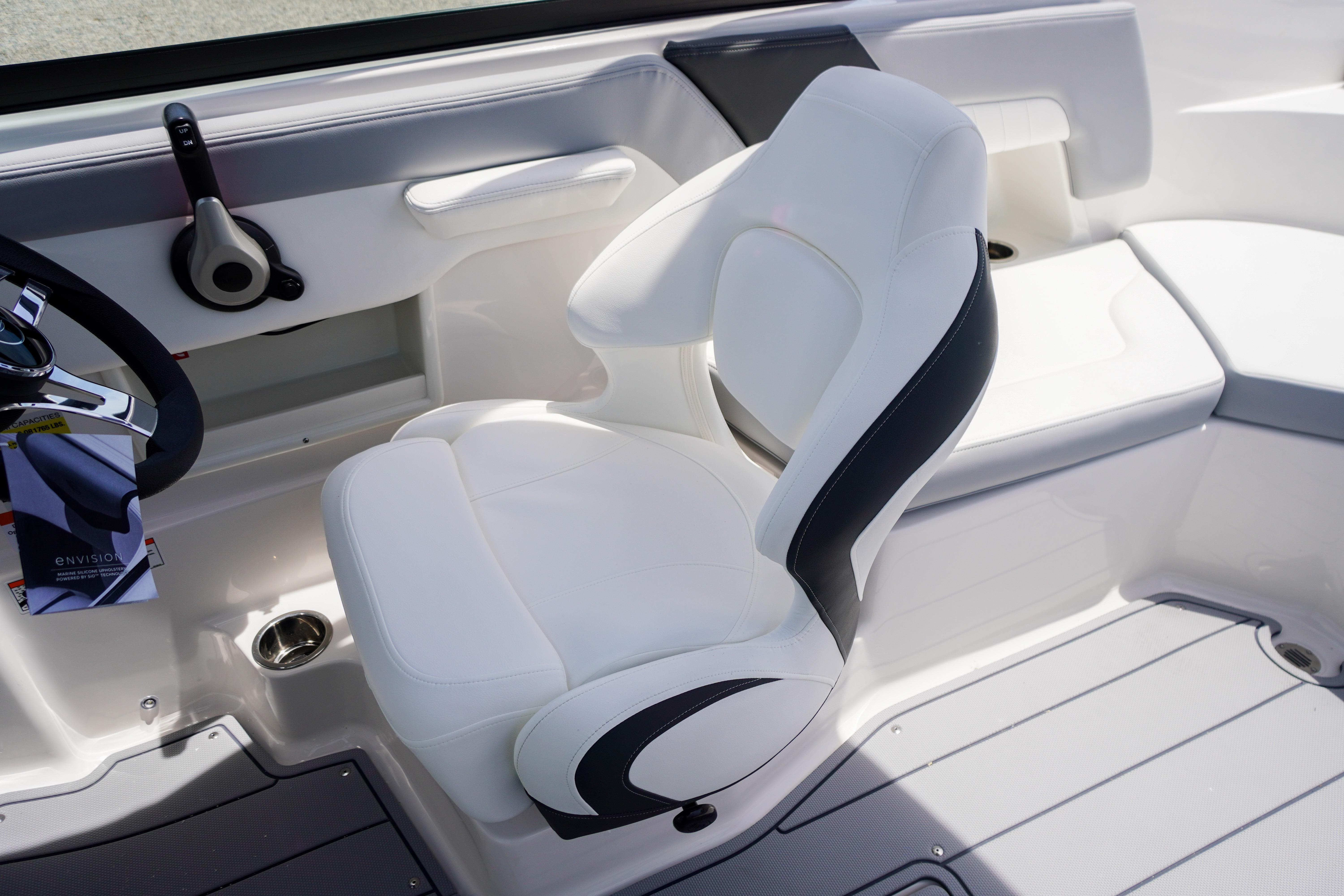Luxury seating in 2026 Chaparral 23 SSi OB boat, featuring sleek white and black design.