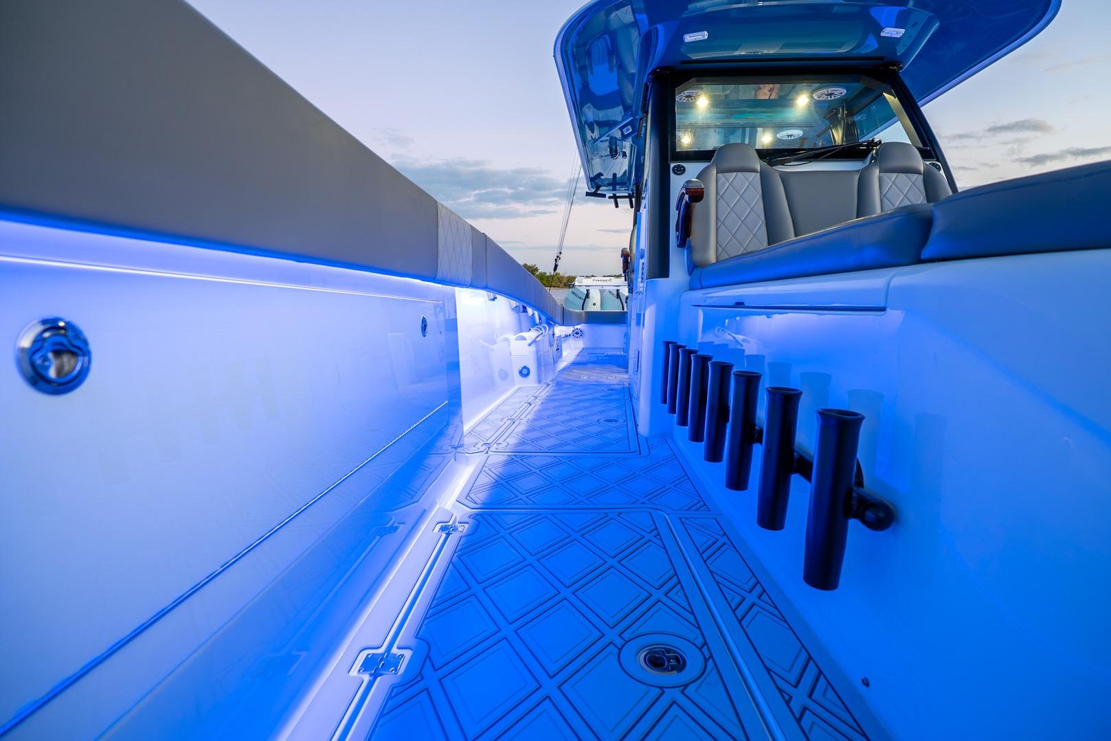 2025 Freeman 43 boat interior with blue LED lighting and modern seating.
