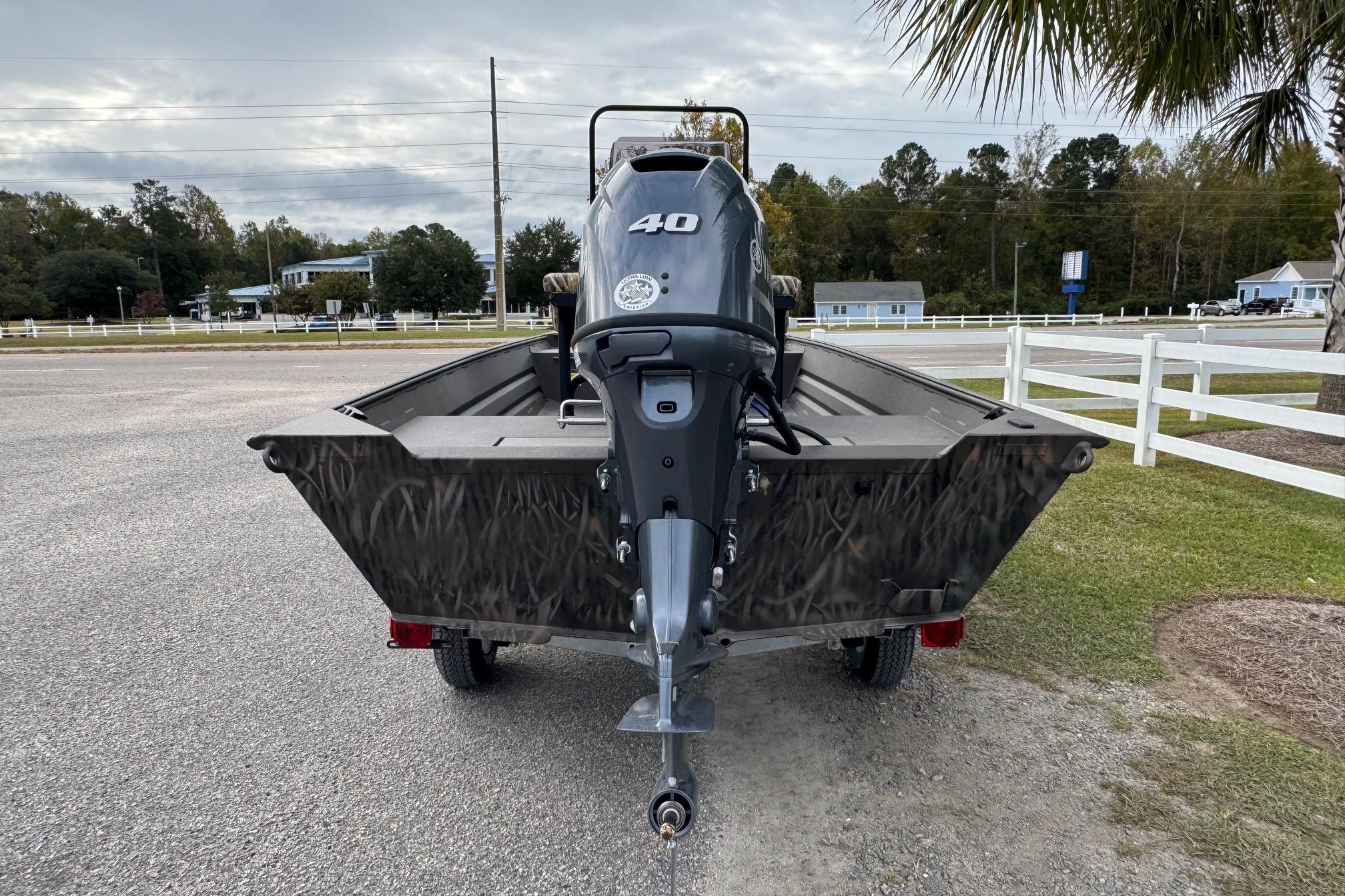 2026 Alweld 1656VV Marsh Console CC boat with 40HP motor, parked outdoors.