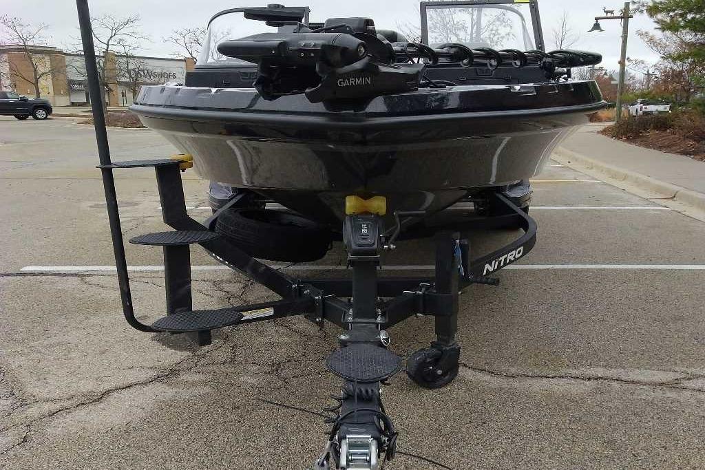 Front view of 2026 Nitro ZV20 Pro boat on trailer in parking lot.