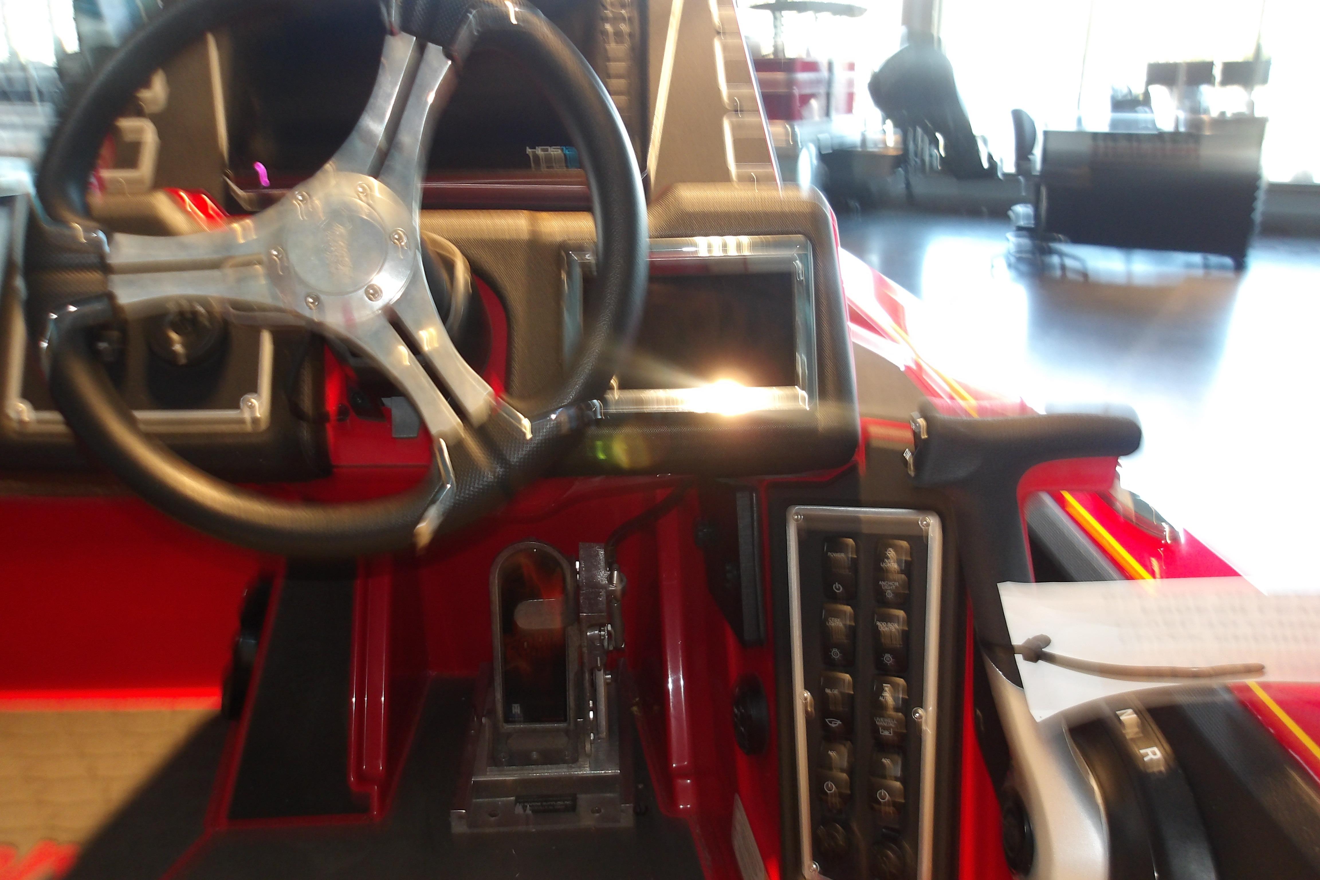 2025 Ranger Z519R Cup-Equipped boat dashboard with steering wheel and control panel.