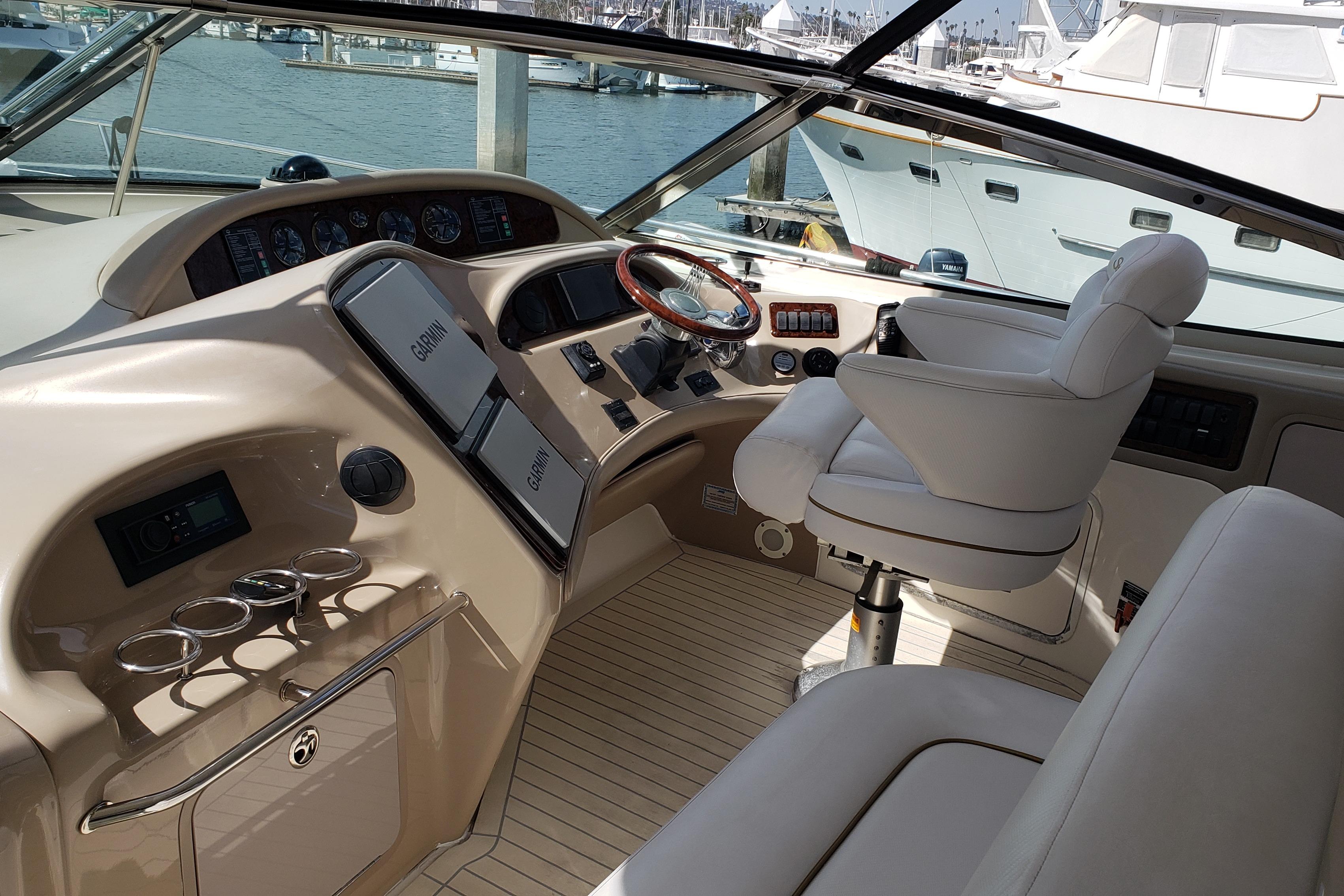 2004 Sea Ray 550 Sundancer helm with luxurious seating and advanced navigation systems.