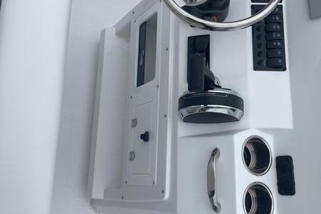 2025 Stingray 173CC boat dashboard with steering wheel and control panel.