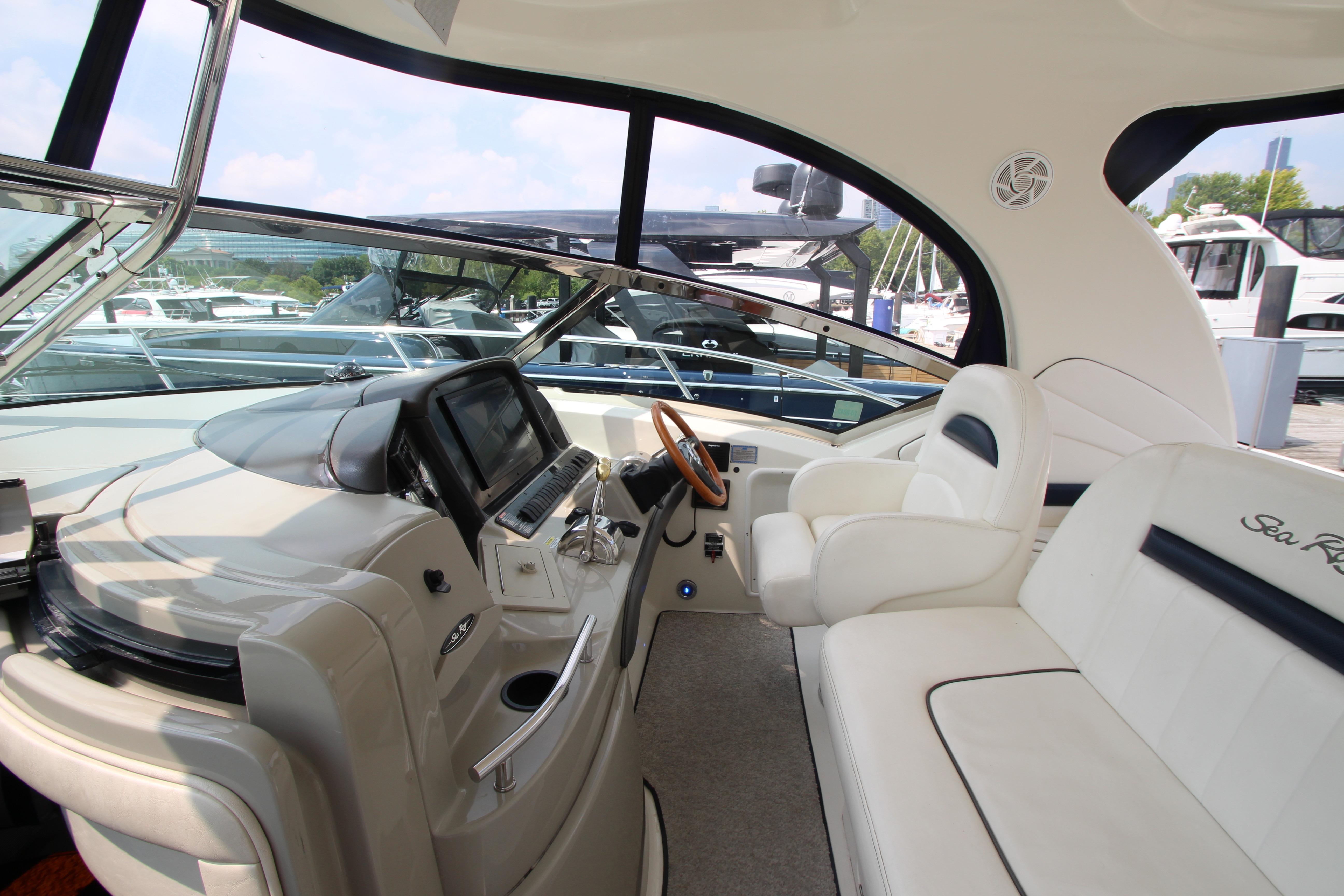 2004 Sea Ray 40 Sundancer helm with luxurious seating and modern controls.