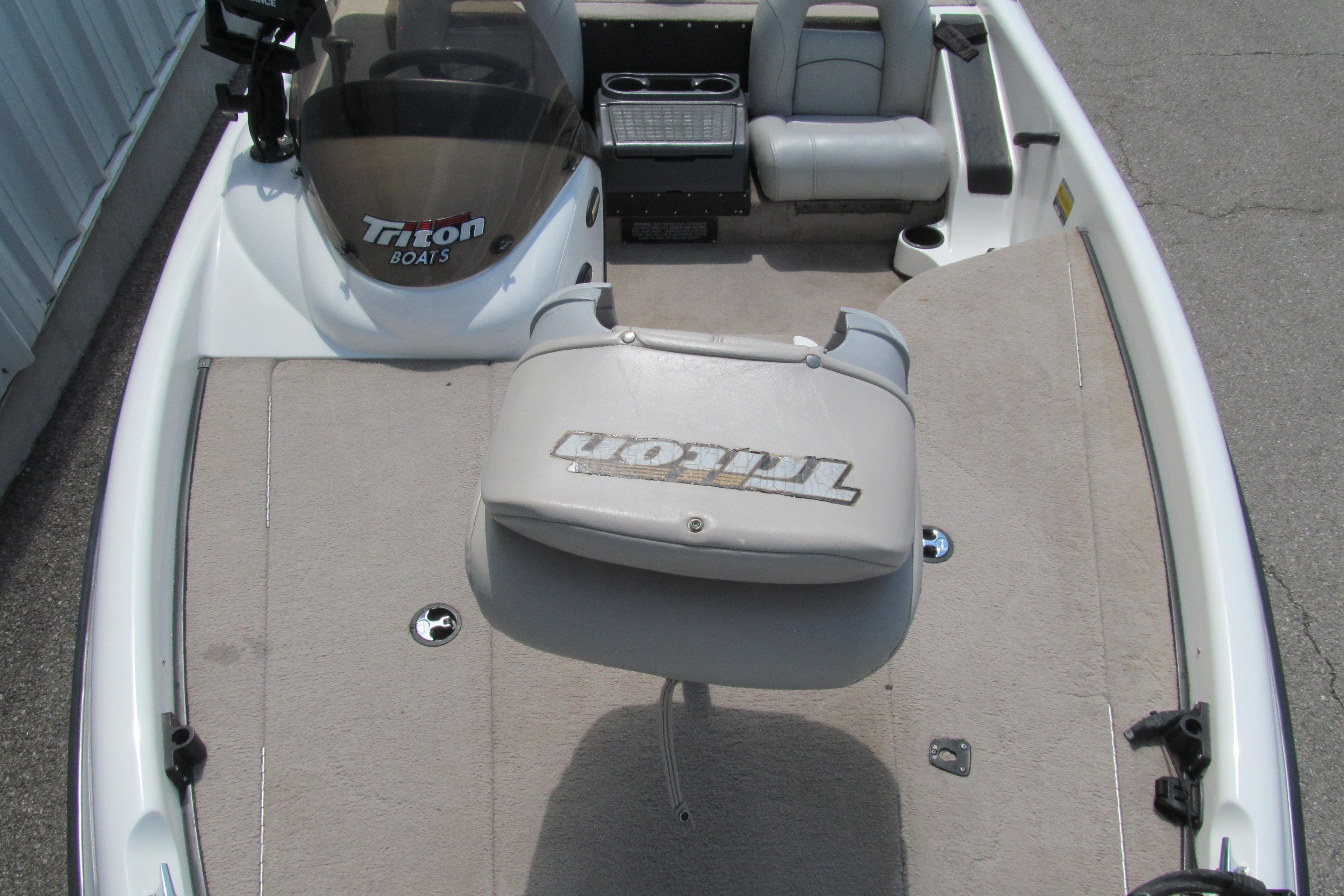 2002 Triton Tr-176 SC boat interior with seating and steering console.