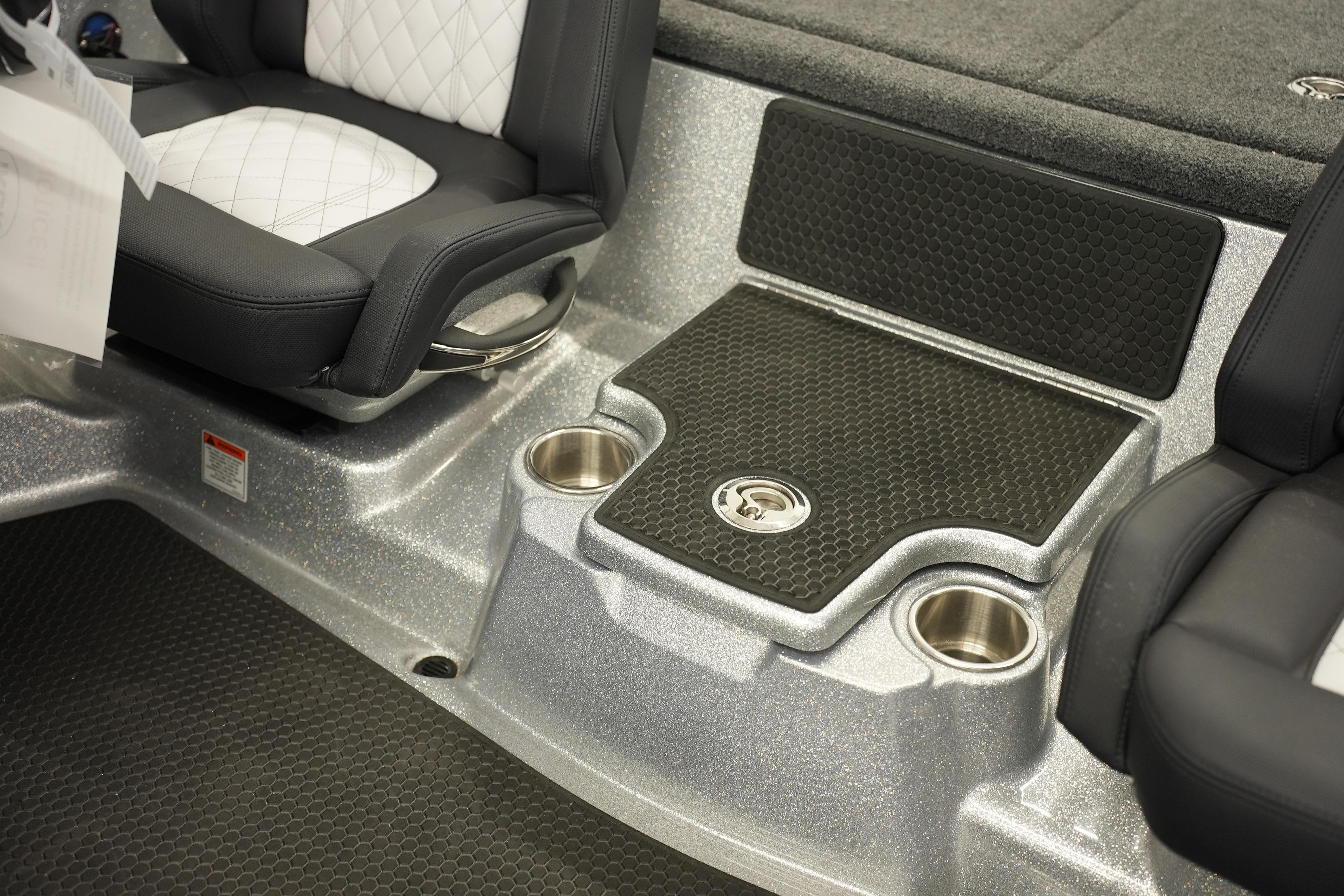 Interior of 2026 iKon LXE20 boat with cushioned seats and cup holders.