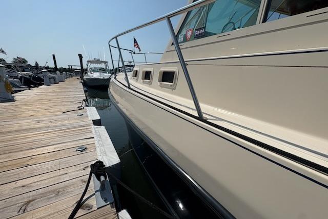 2003 Albin 28 Tournament Express docked at a marina, side view.