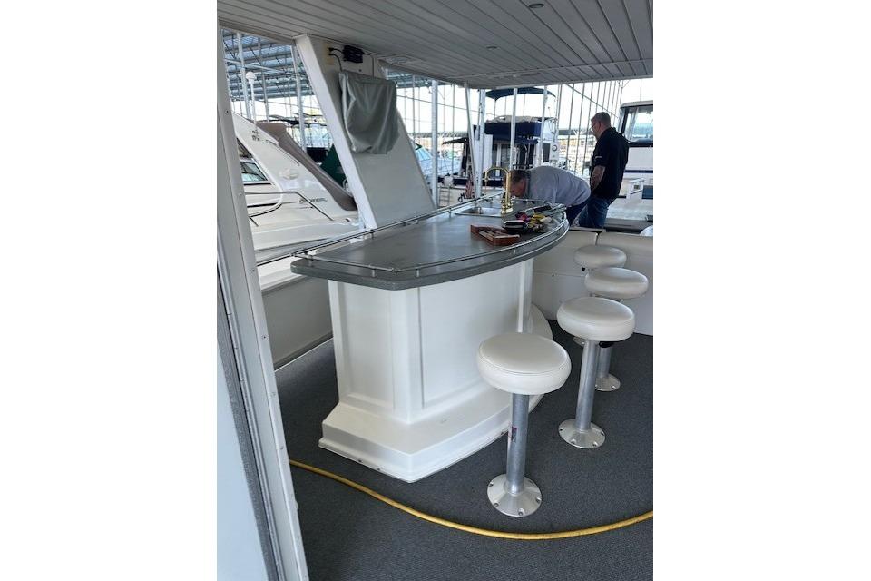 2008 Destination Yachts 45X14 interior with bar and stools on a yacht.