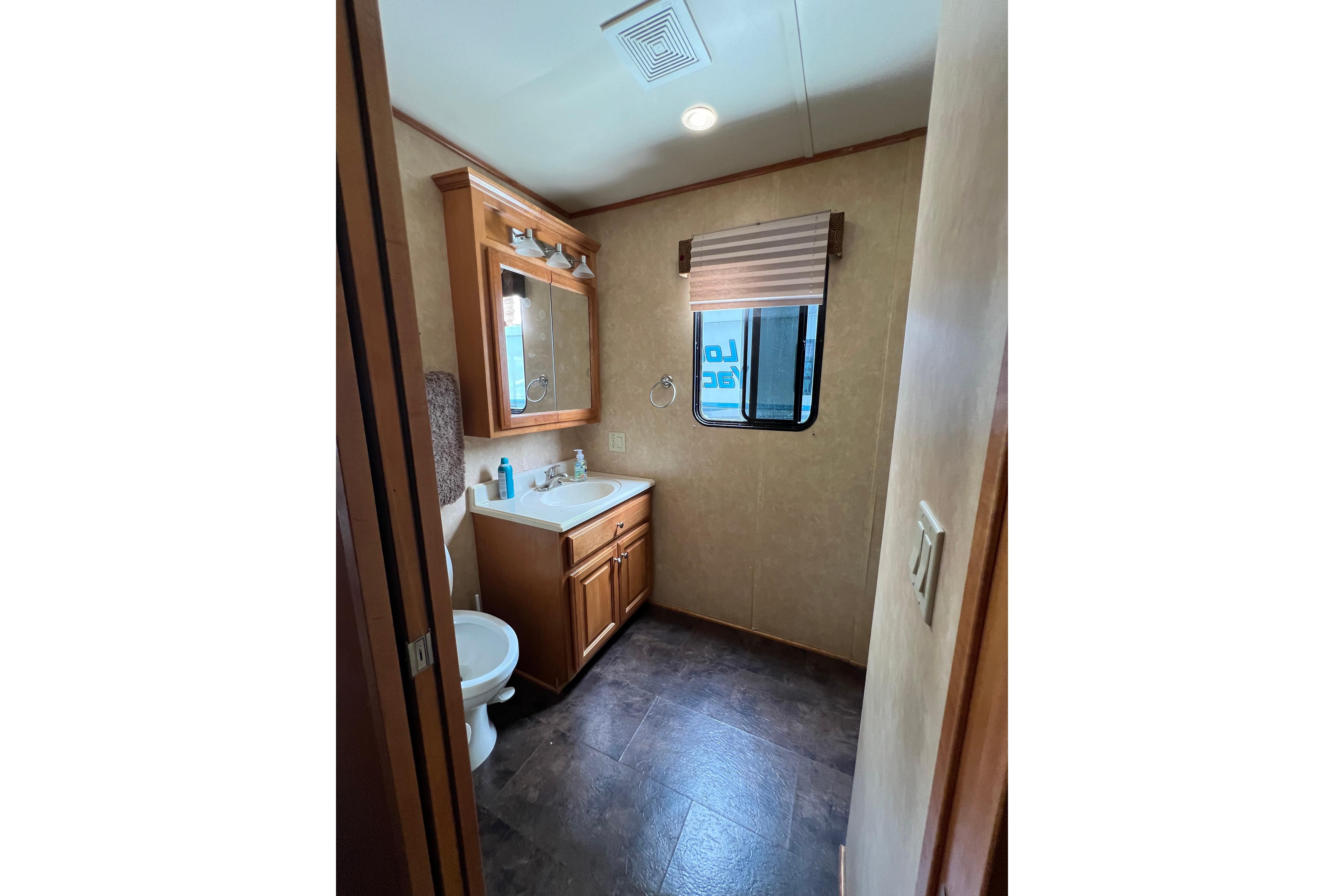 Bathroom interior of 2013 Destination Yacht Lotta Yachta with sink, mirror, and window.