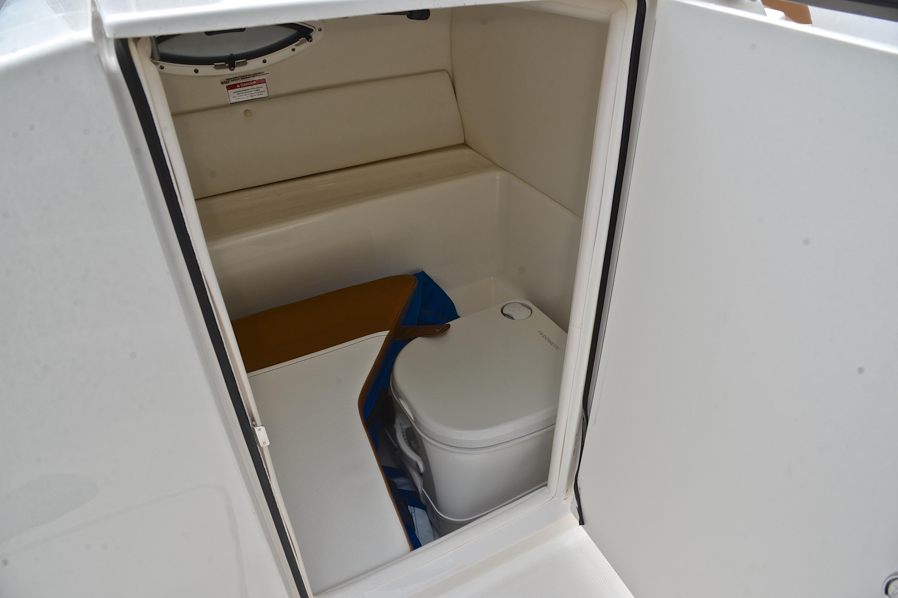 2019 Bayliner VR6 Bowrider OB interior with compact marine toilet.