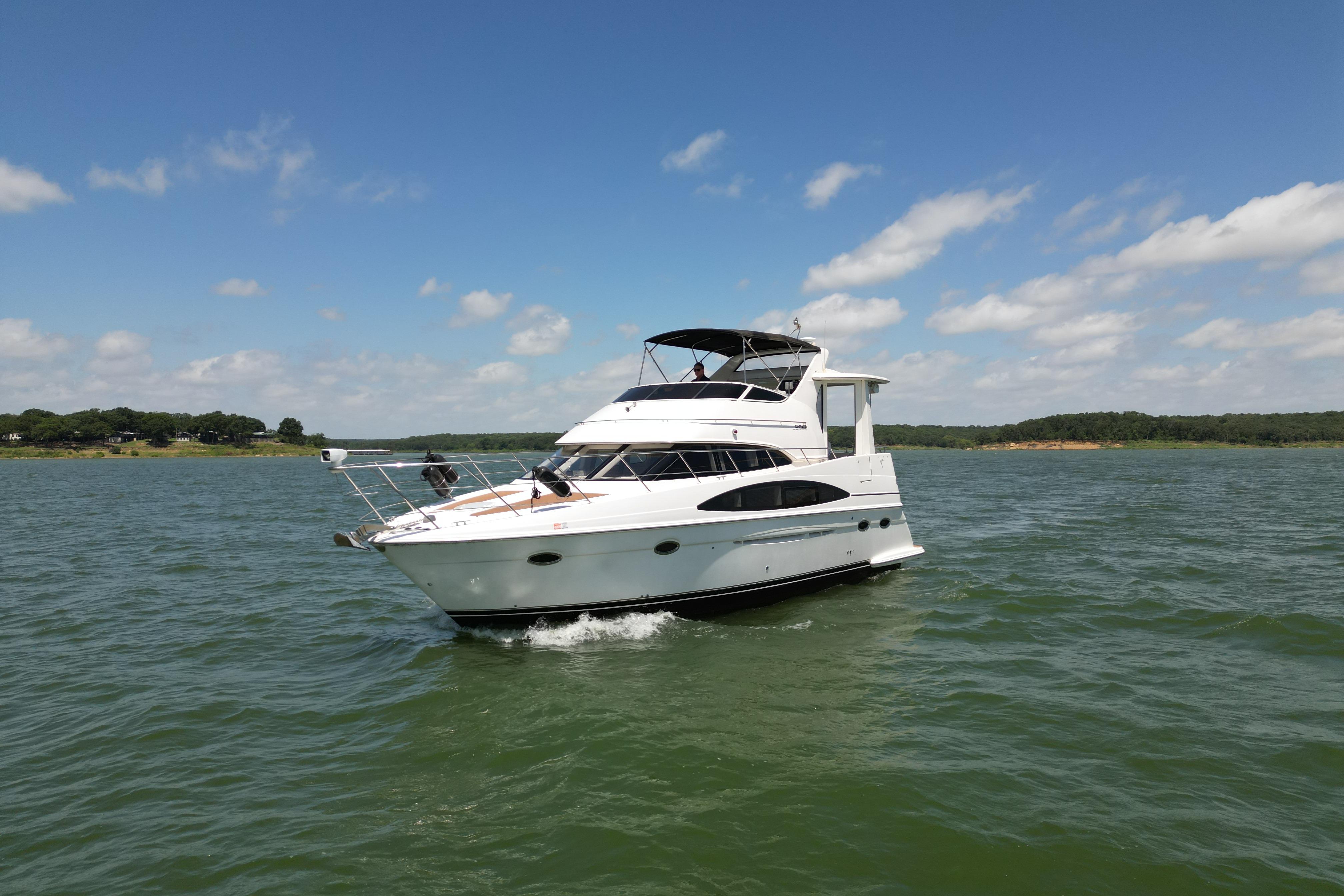 2002 Carver 396 Motor Yacht cruising on a sunny day with clear skies.