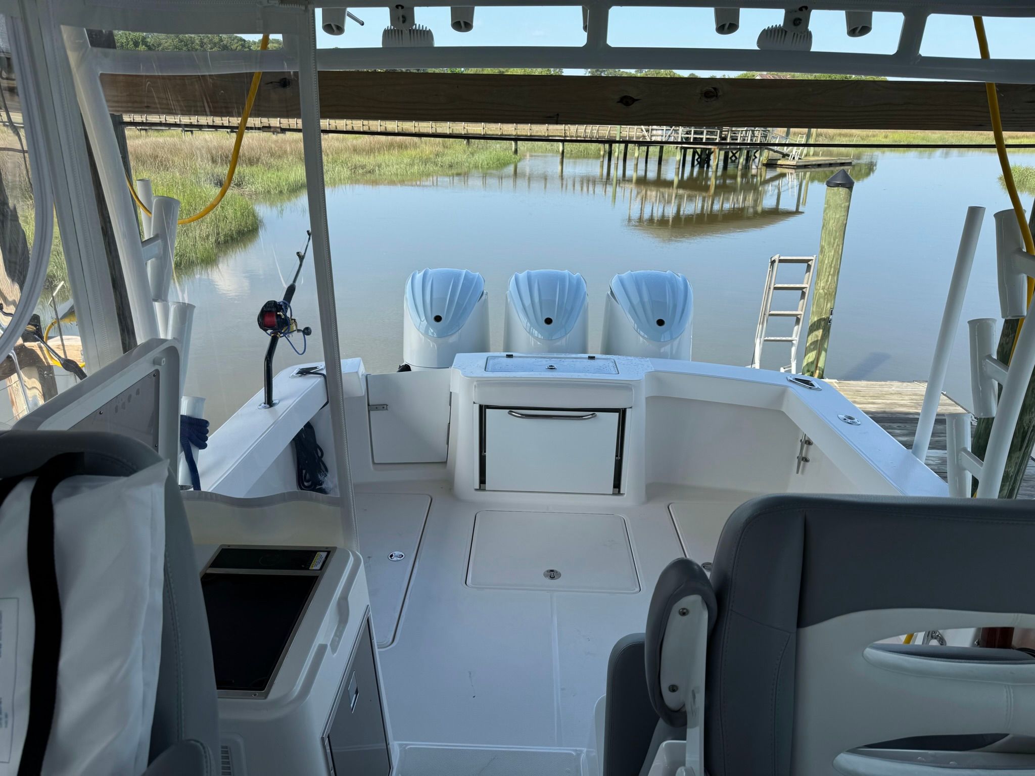The image shows the cockpit of a 2024 Albemarle 30 Express boat with three outboard motors.