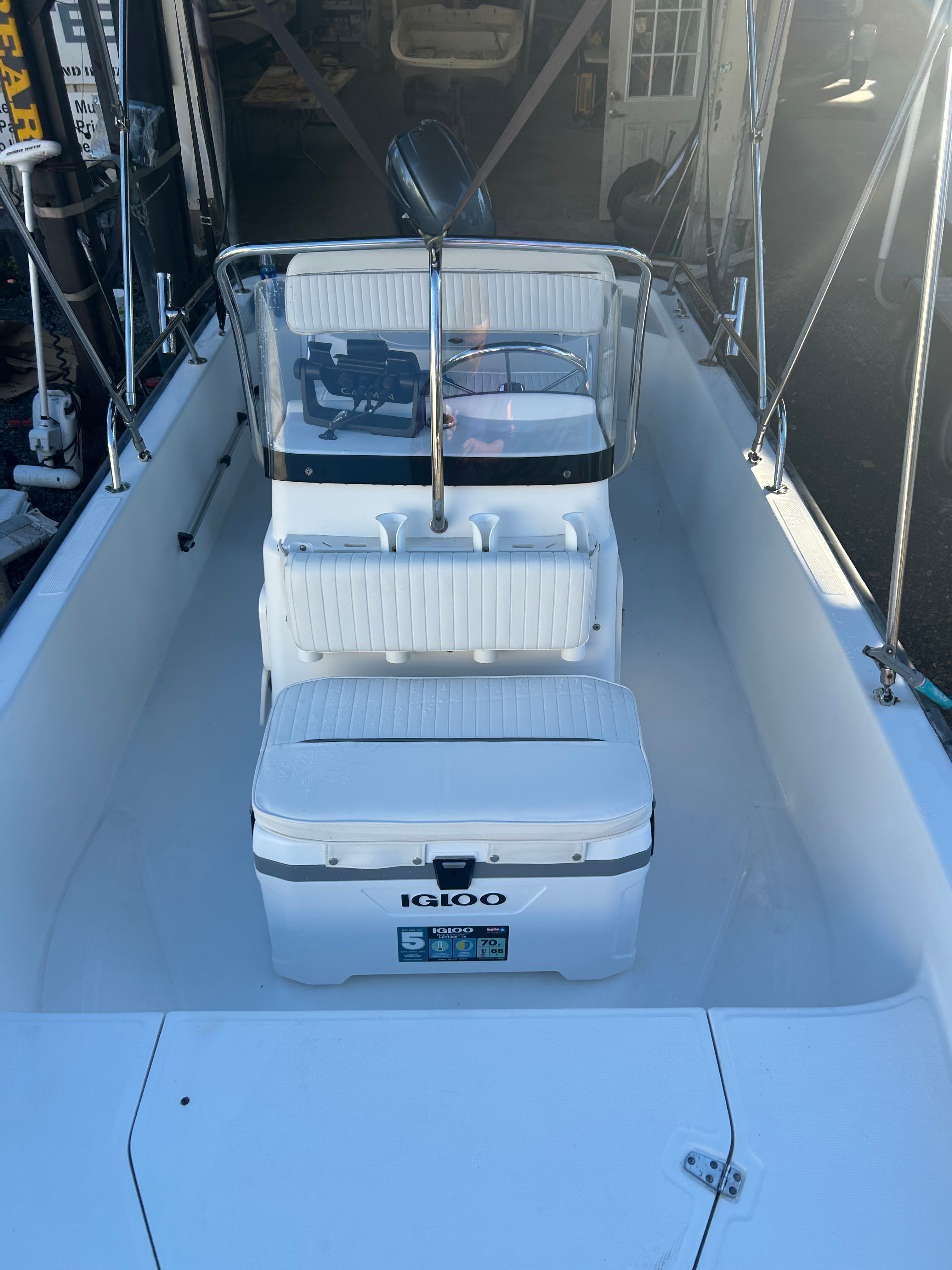 Interior view of a 2006 Boston Whaler 150 Montauk boat with Igloo cooler.