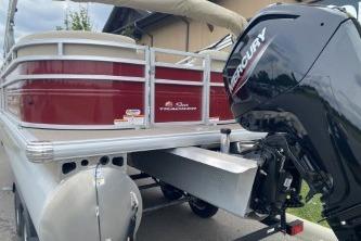 2024 Sun Tracker Party Barge 22 DLX with Mercury outboard motor, rear view.