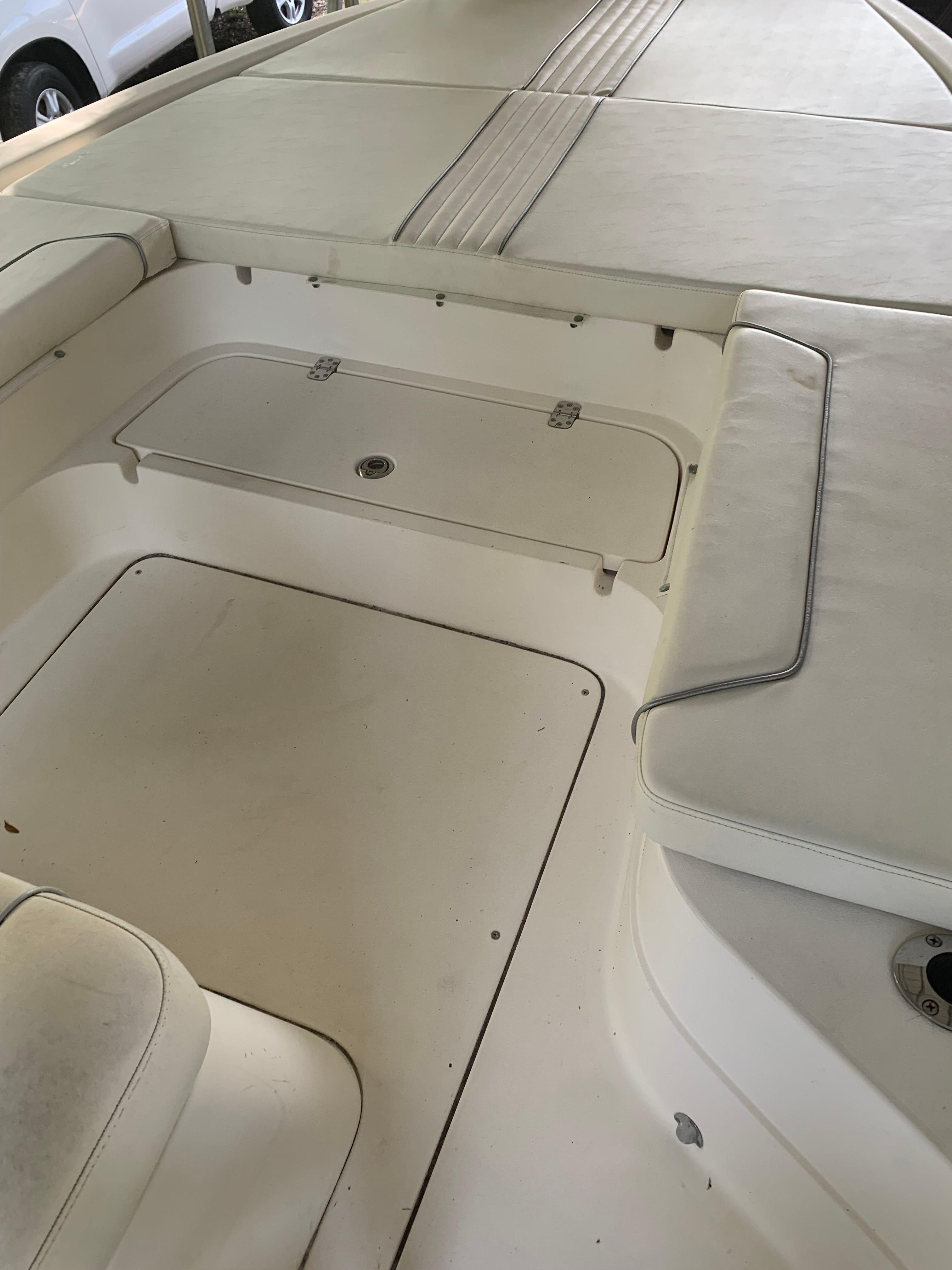 Interior of a 2007 ShearWater 23 LTZ boat with white upholstery.