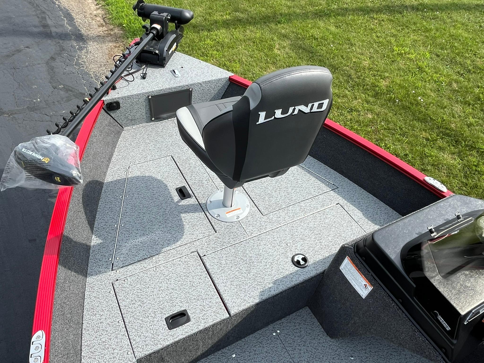 2026 Lund 1650 Angler SS boat interior with seat and trolling motor.